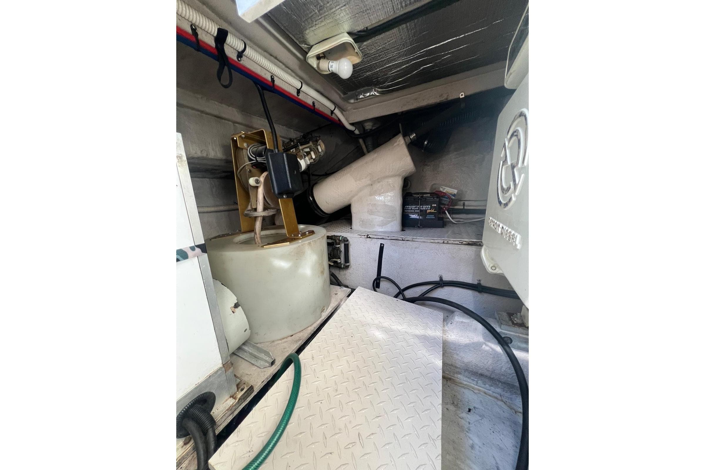 Engine room of a 1997 Sea Ray 500 Sundancer with mechanical components visible.