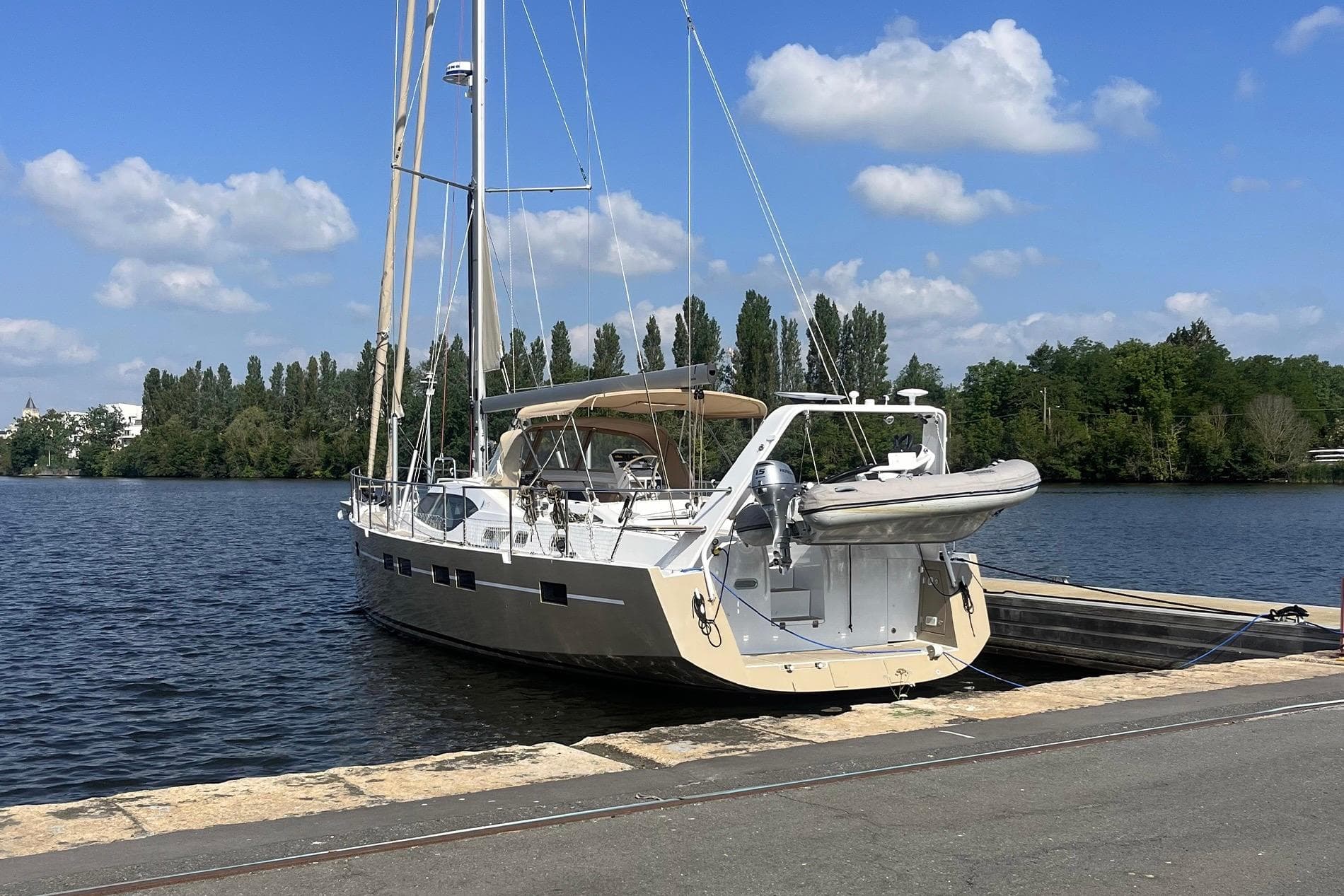 Sloop Garcia Aluminium 51 yacht docked by a serene river, 2023 model.