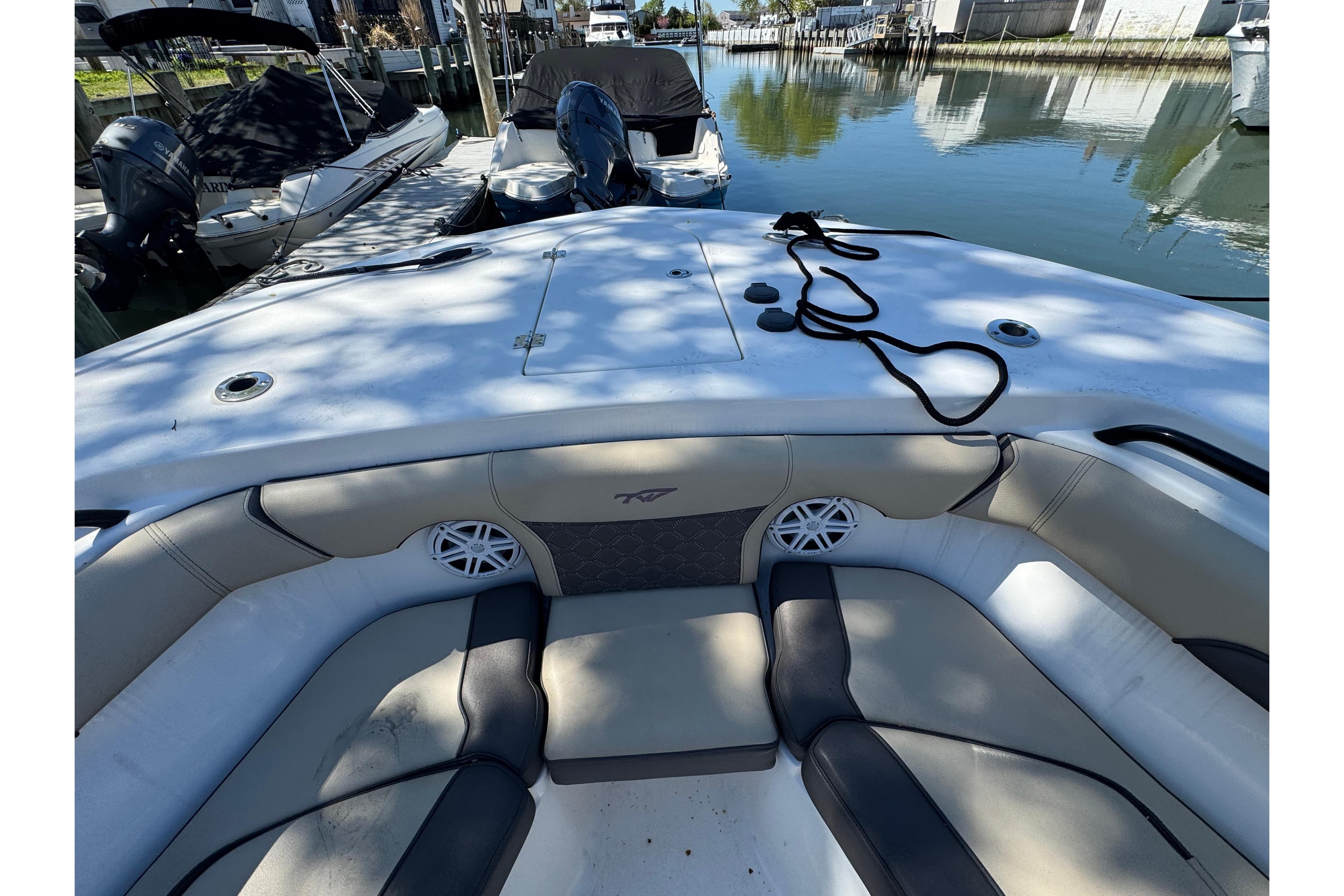 2022 Tidewater 256 CC Adventure boat interior with seating and speakers.