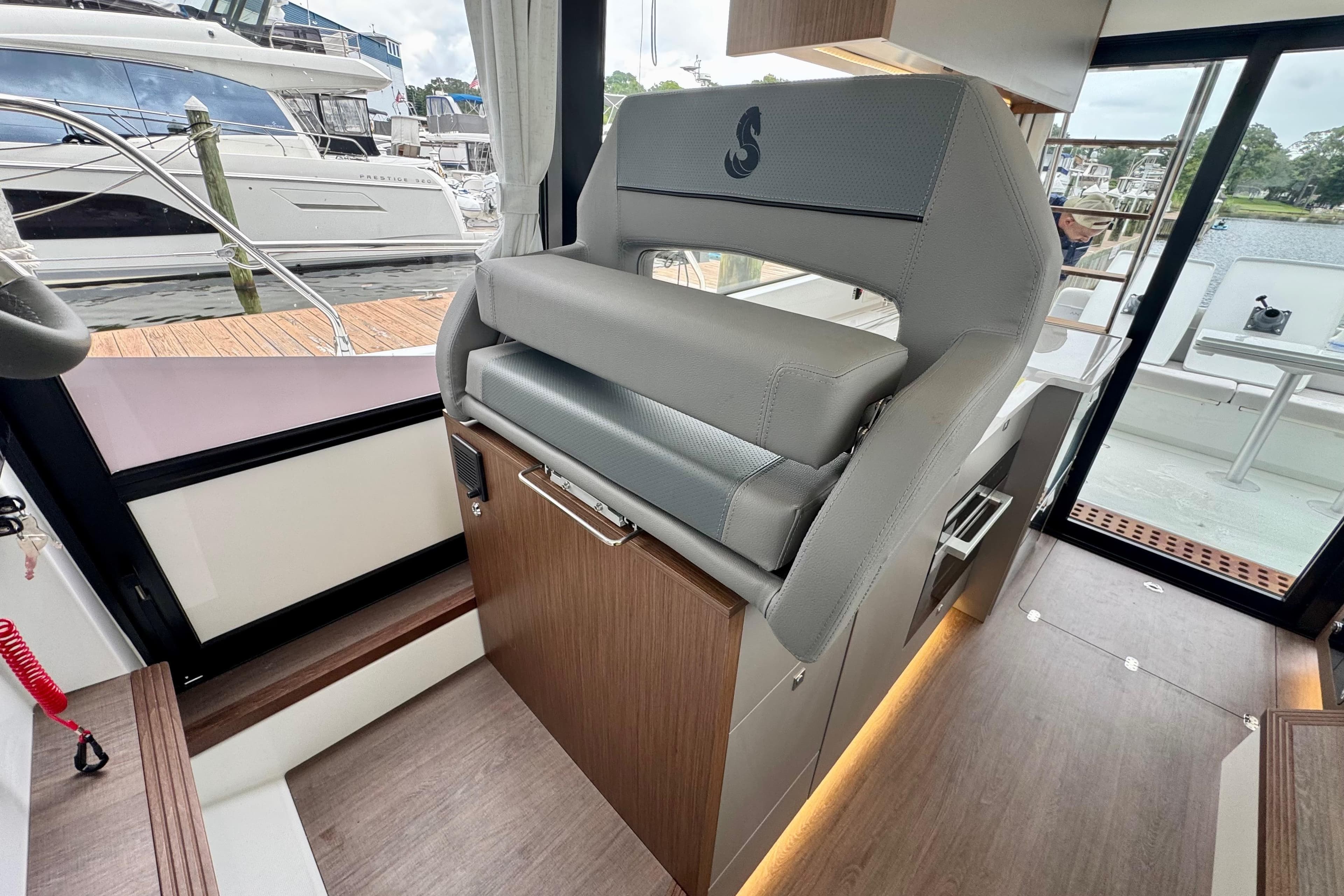2026 Beneteau Antares 12 interior with modern seating and sleek design.