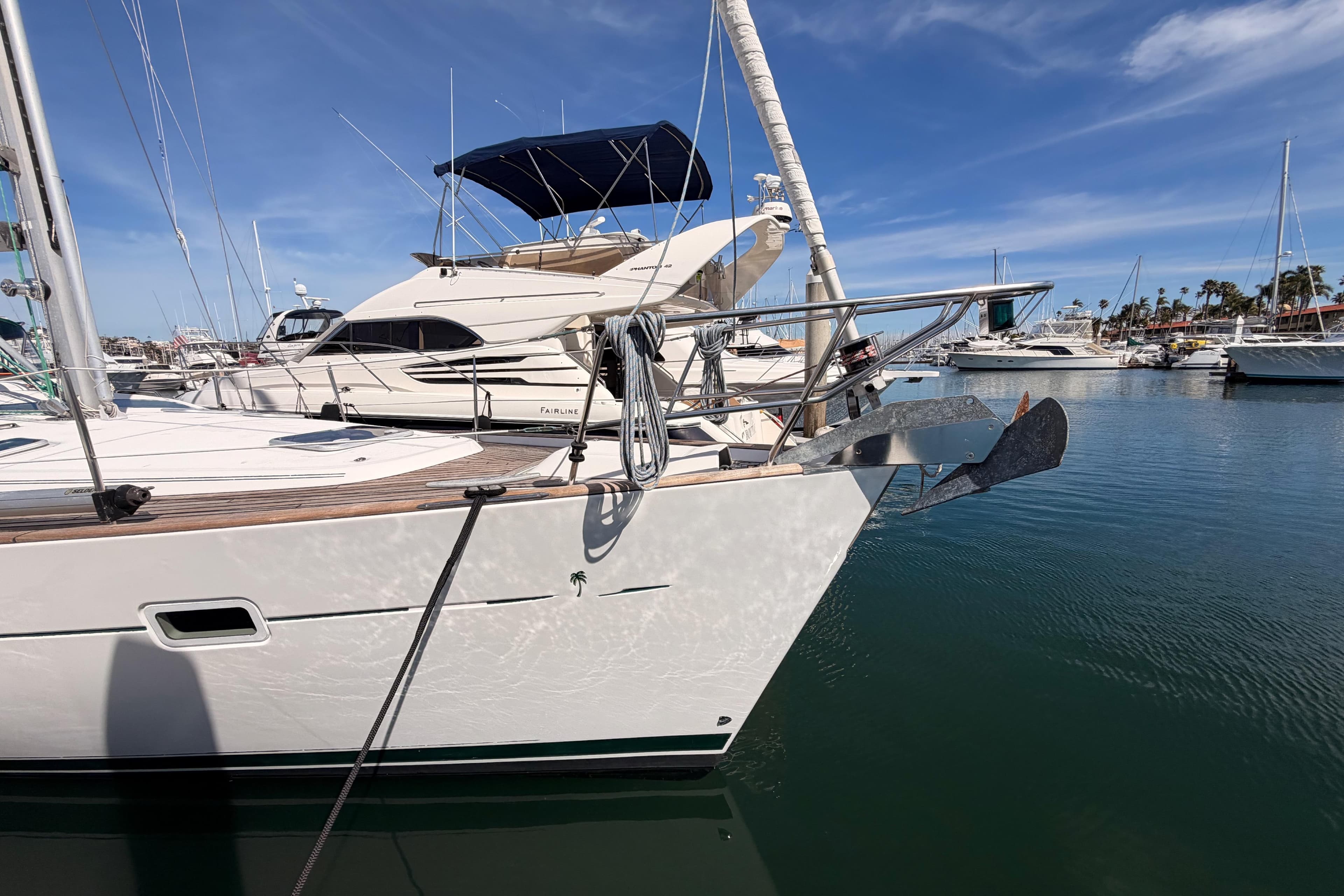 2005 Beneteau Oceanis Clipper 423 yacht docked in a marina under a clear blue sky.