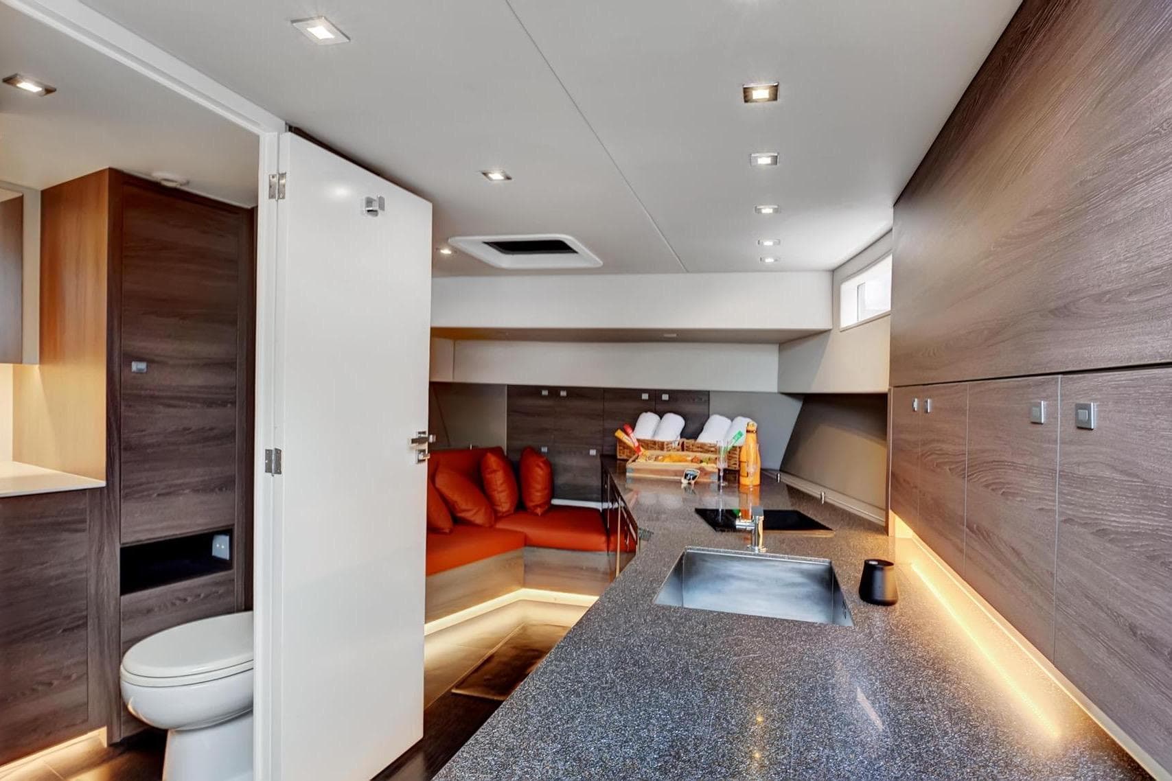 Luxurious interior of 2017 Vanquish Yachts VQ 54 with modern kitchen and seating area.