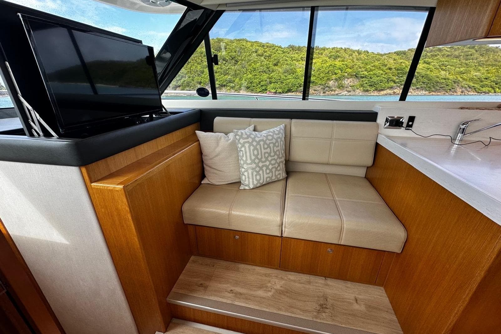Luxurious interior of 2020 Riviera 395 SUV with leather seating and scenic window view.