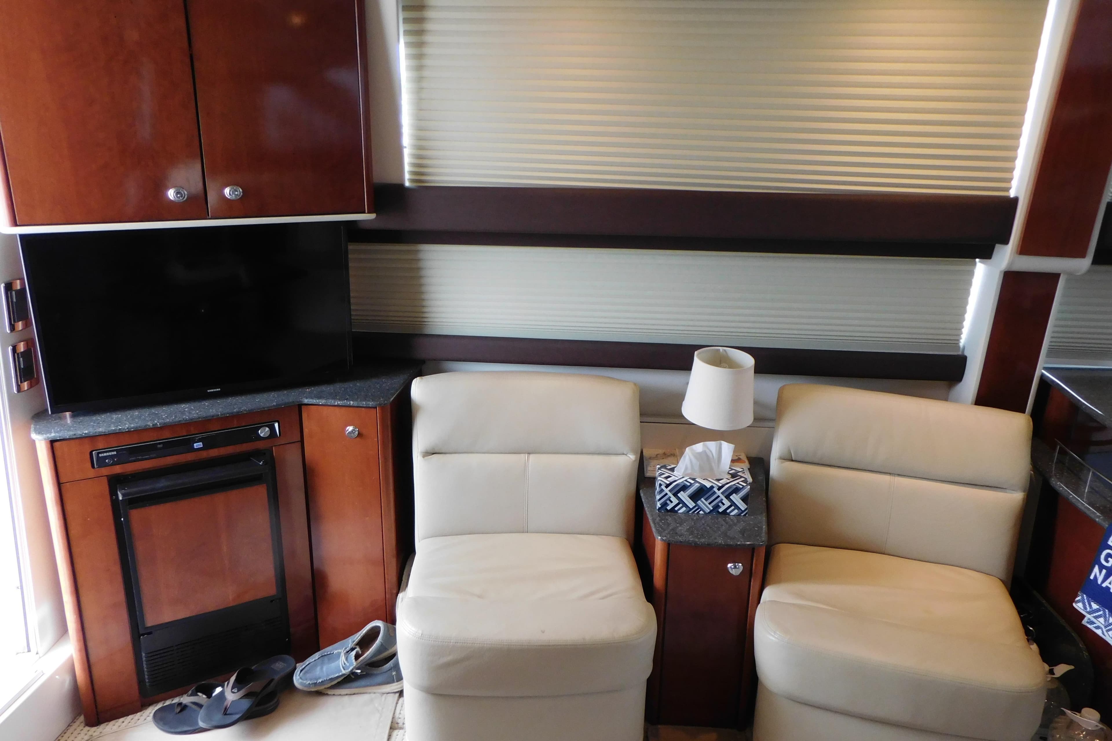 Interior of 2009 Meridian 391 Sedan with beige seating and wooden cabinetry.