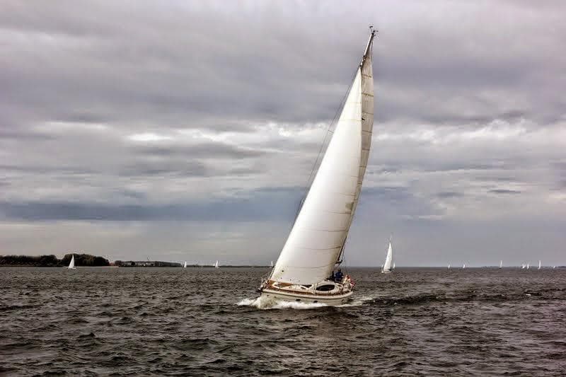 Sailing yacht Etap 46 DS from 2007 navigating on a cloudy day.