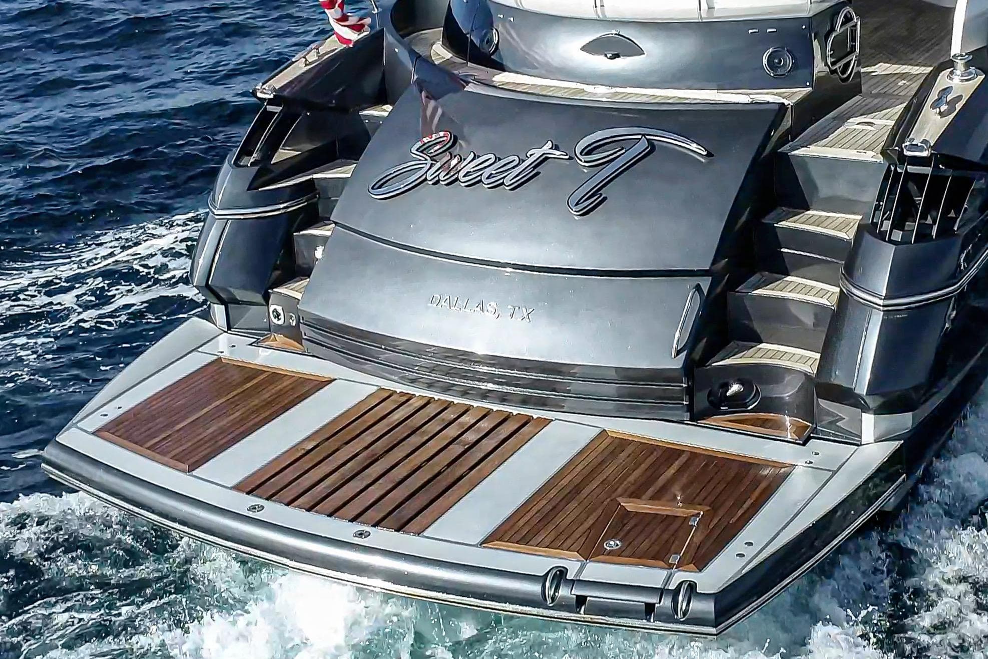 2021 Sunseeker Predator 68 yacht with wooden deck, cruising on ocean waters.