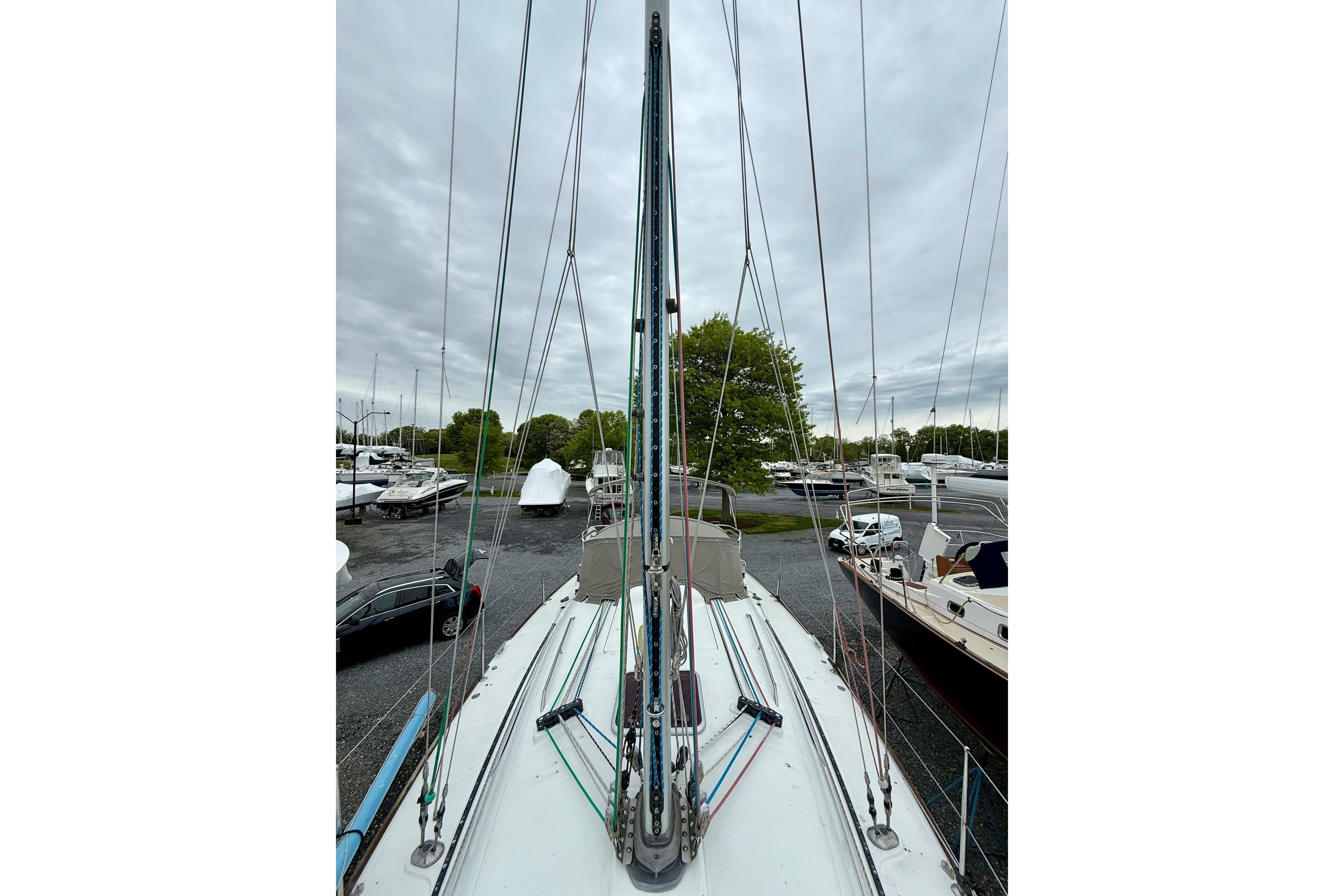 2005 Beneteau First 36.7 sailboat with mast and rigging, docked in a marina.