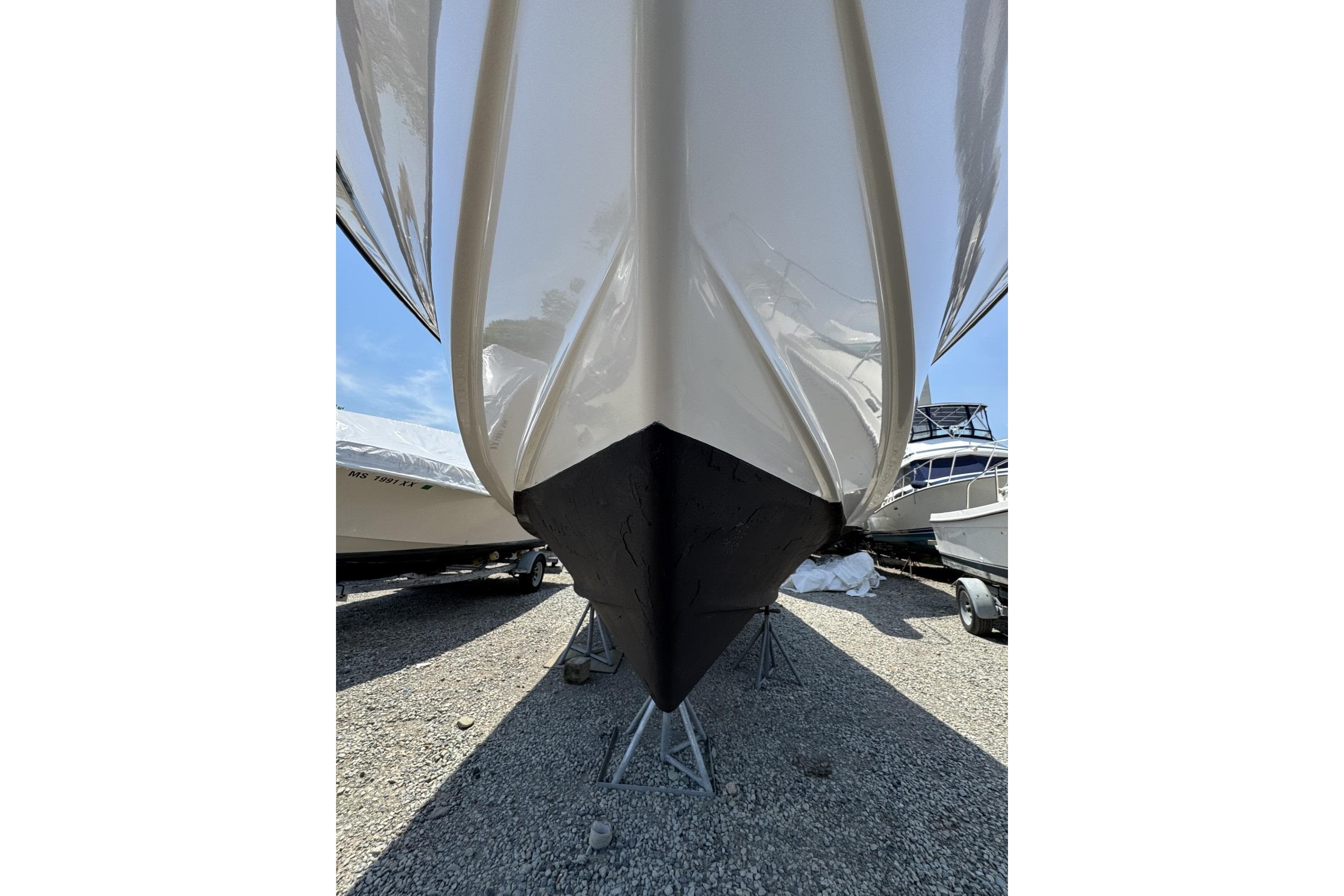 2003 Grady-White Sailfish 282 boat hull on stands, displayed outdoors.