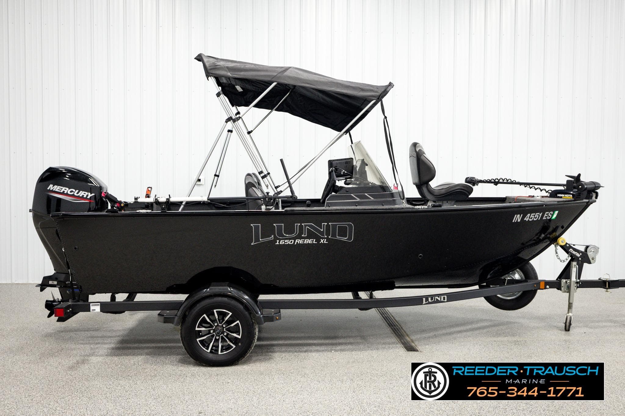 2025 Lund 1650 Rebel XL SS boat with Mercury engine on trailer.