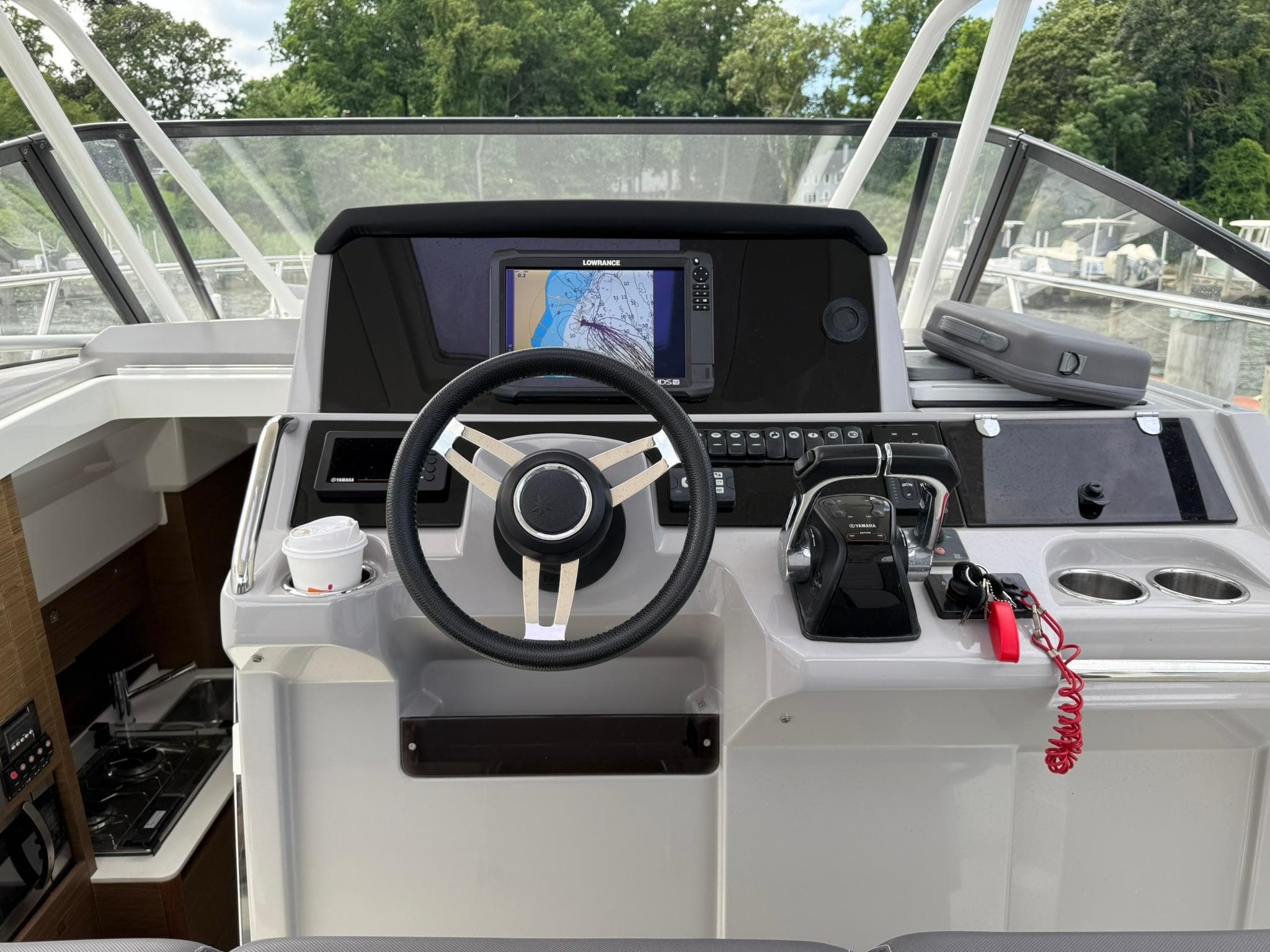 Helm of 2018 Jeanneau Leader 10.5 with navigation system and controls.