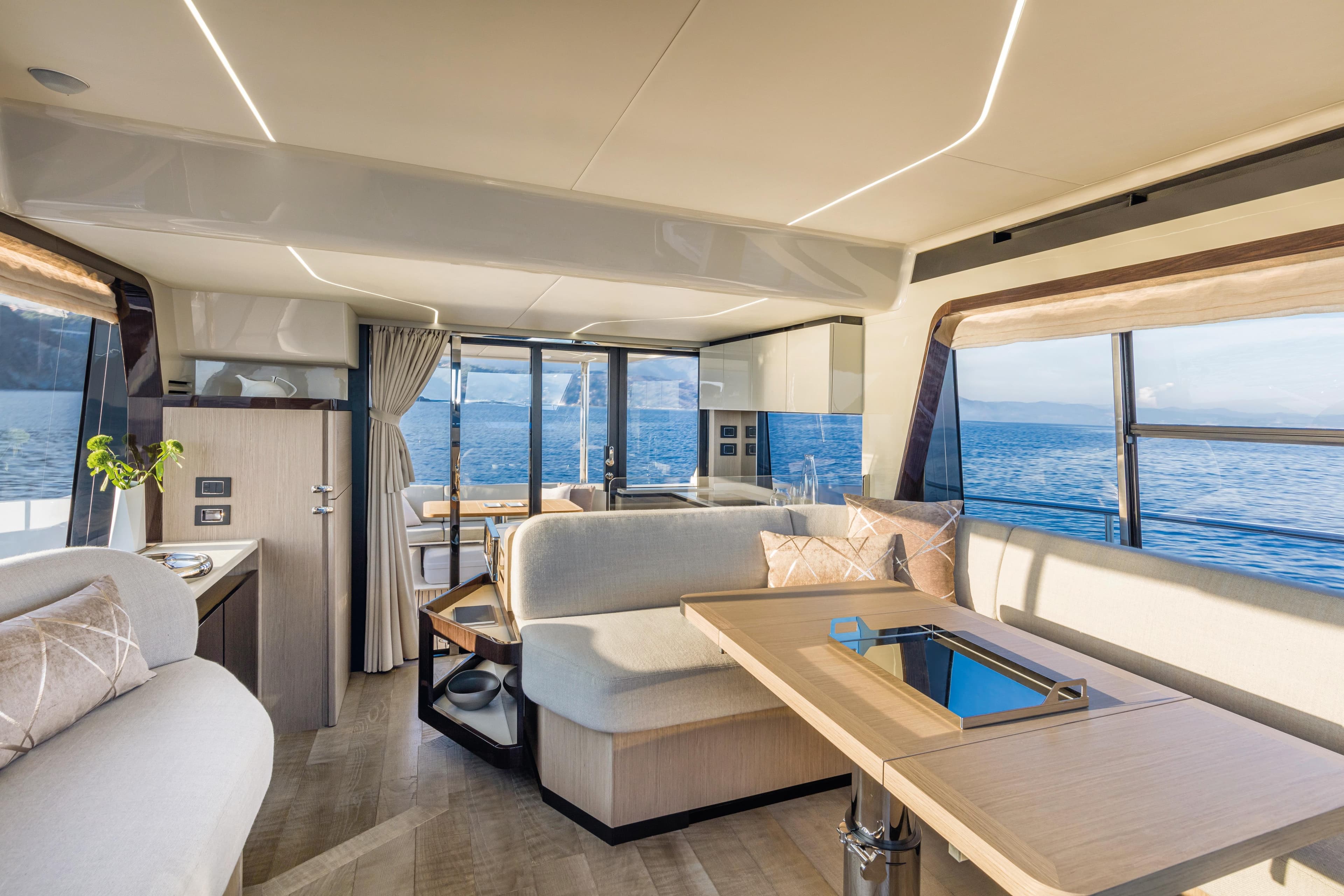 Luxurious interior of the 2025 Absolute 47 Fly yacht with panoramic ocean views.