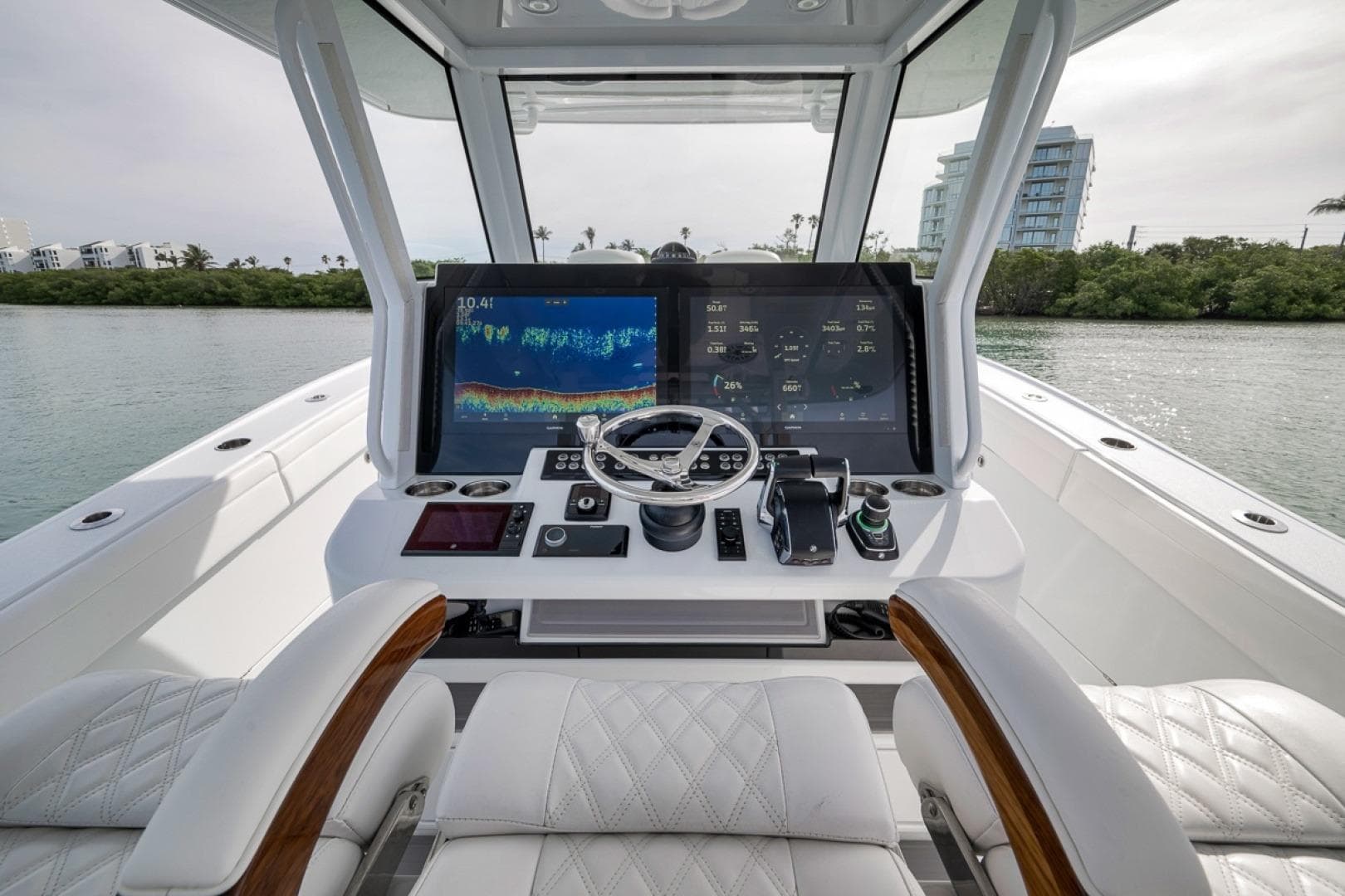 2024 Costa Custom Boats 34SV helm with advanced navigation displays and luxurious seating.