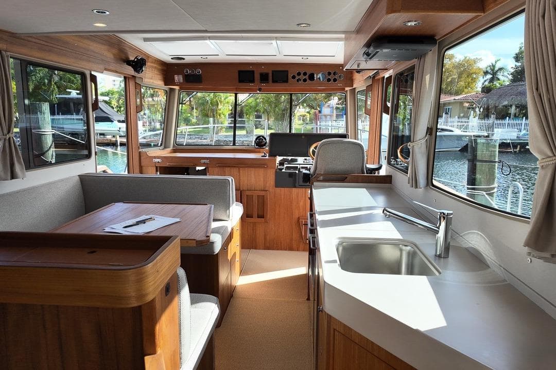 Interior of 2026 Targa 41 boat with modern kitchen and seating area.