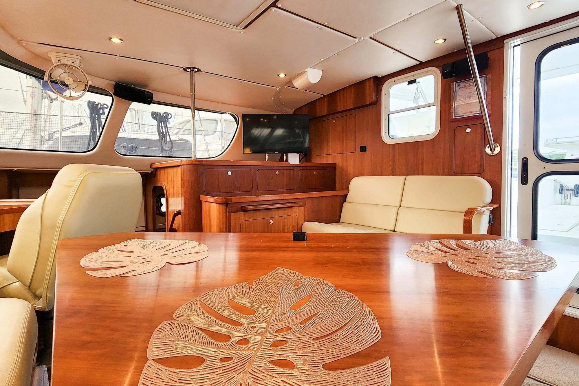 Luxurious 2019 Antares 44GT yacht interior with elegant wood finish and comfortable seating.