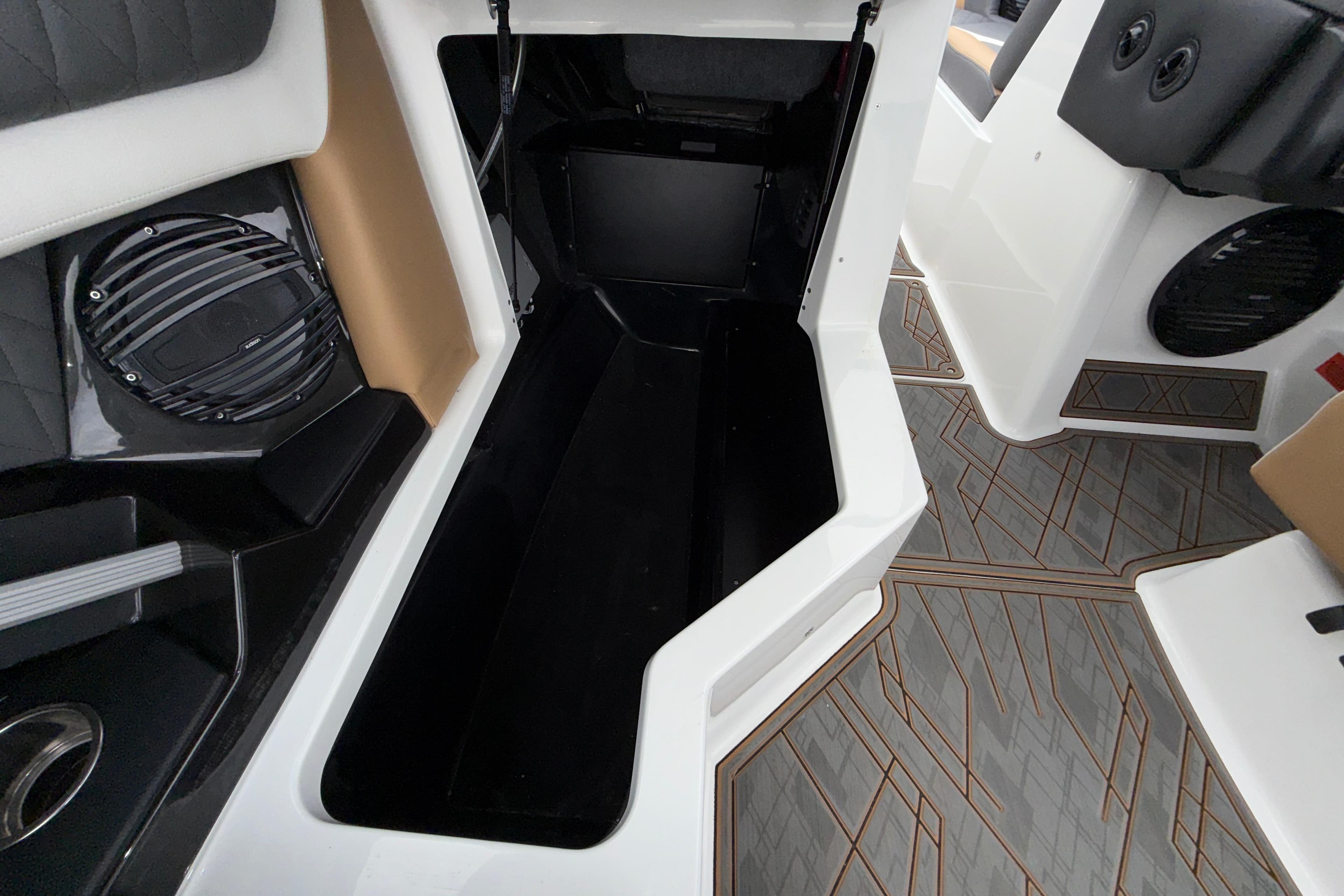 2023 Tigé 23ZX boat interior storage compartment with modern design and speaker system.