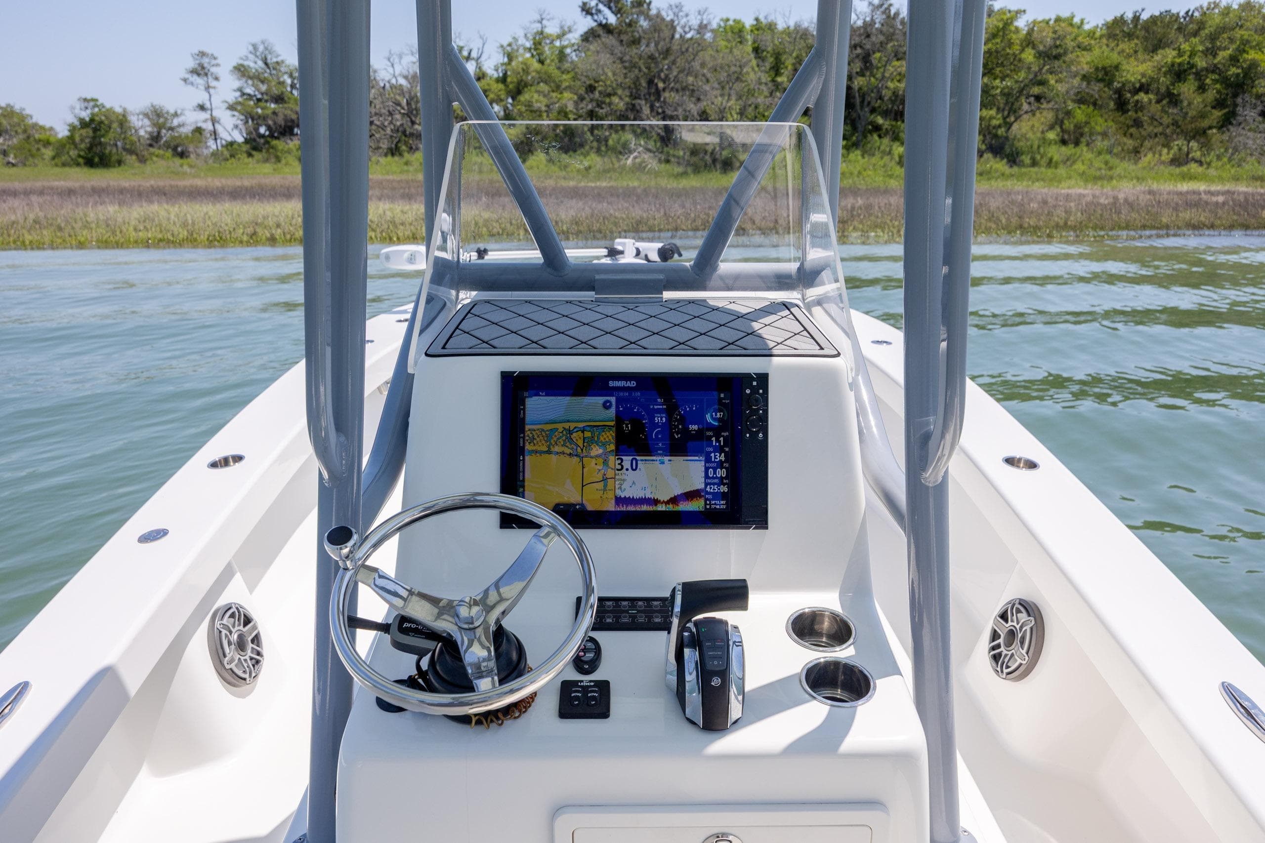 2022 ZCB Freemason 26 boat console with navigation display on calm water.