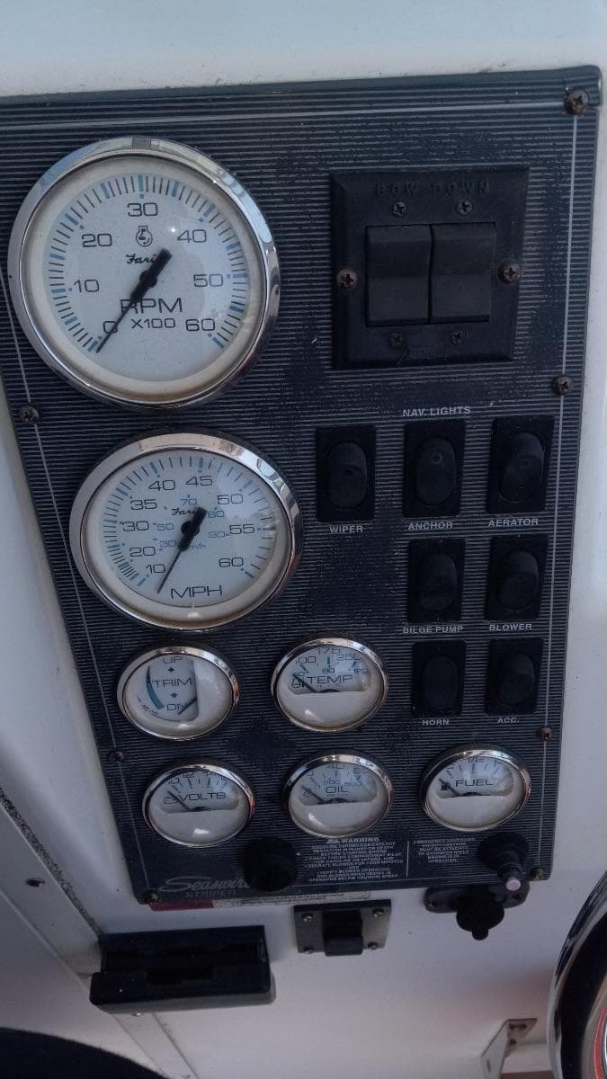 Dashboard of a 2001 Seaswirl Striper 2600 Sport Cabin I/O with gauges and switches.