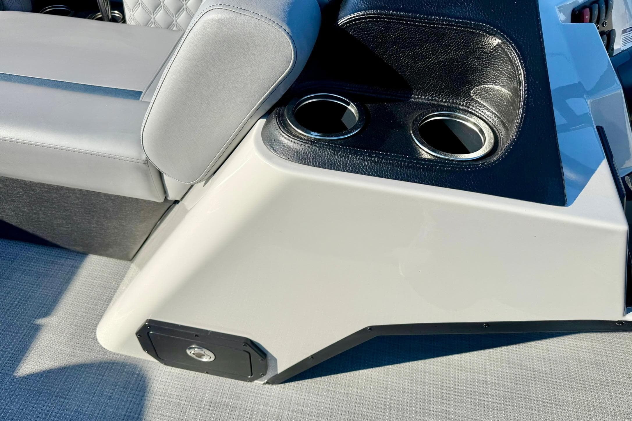 2026 Crest Conquest 210 Fish boat interior with cup holders and cushioned seating.