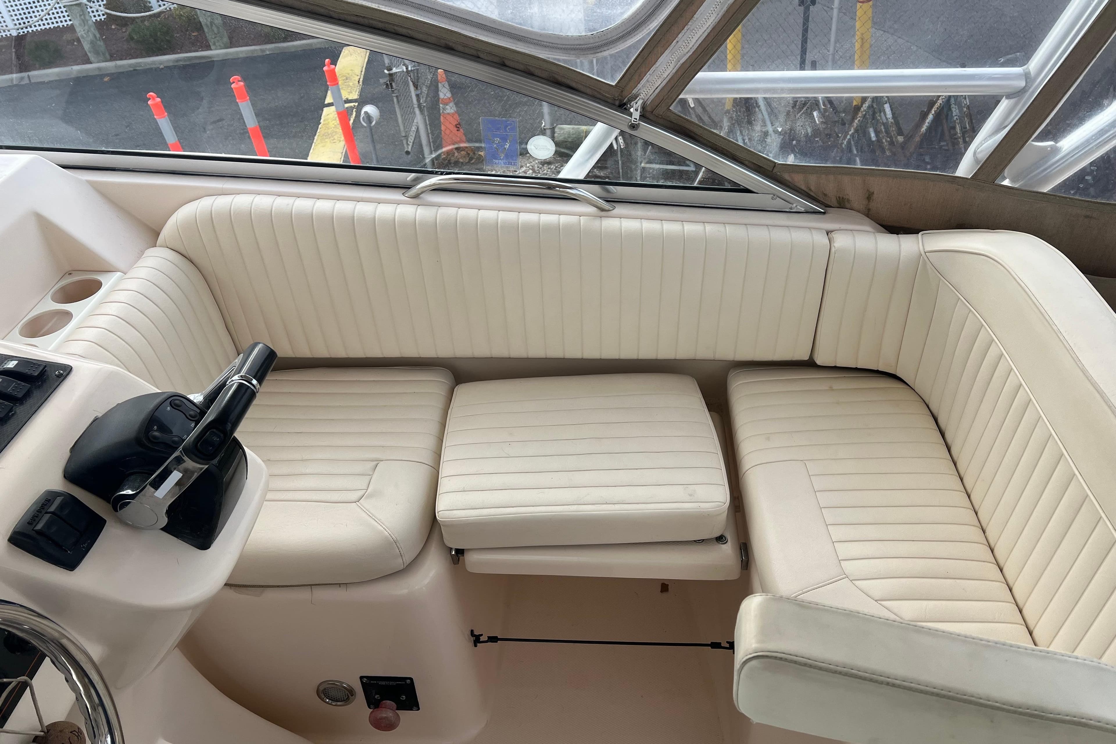 2006 Grady-White Express 330 boat interior with cream seating and control panel.
