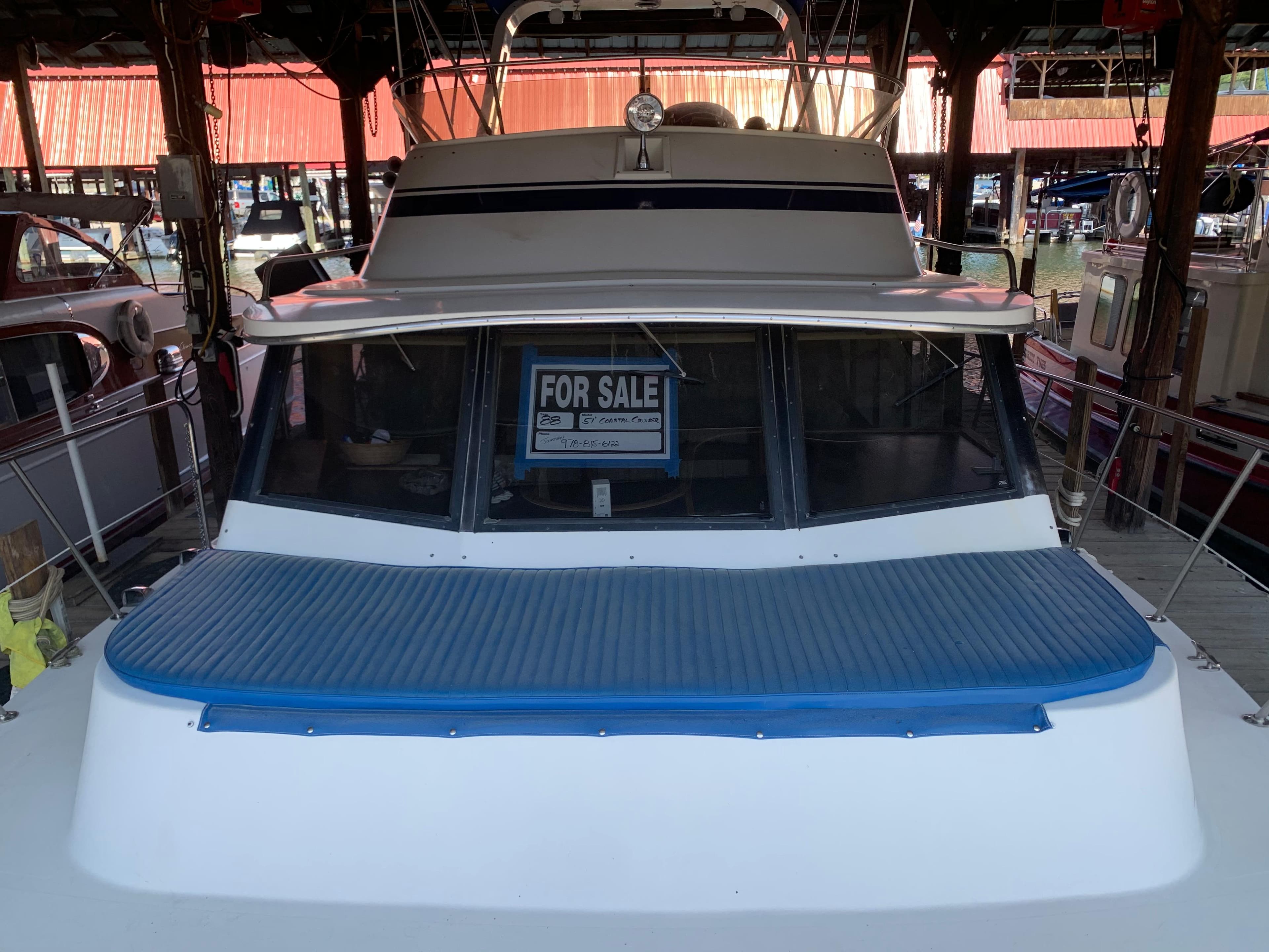 1988 Blue Water Coastal Cruiser boat for sale in marina.