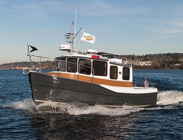 Manufacturer Provided Image: 2015 Ranger Tugs R-25SC cruising on a lake with scenic background.