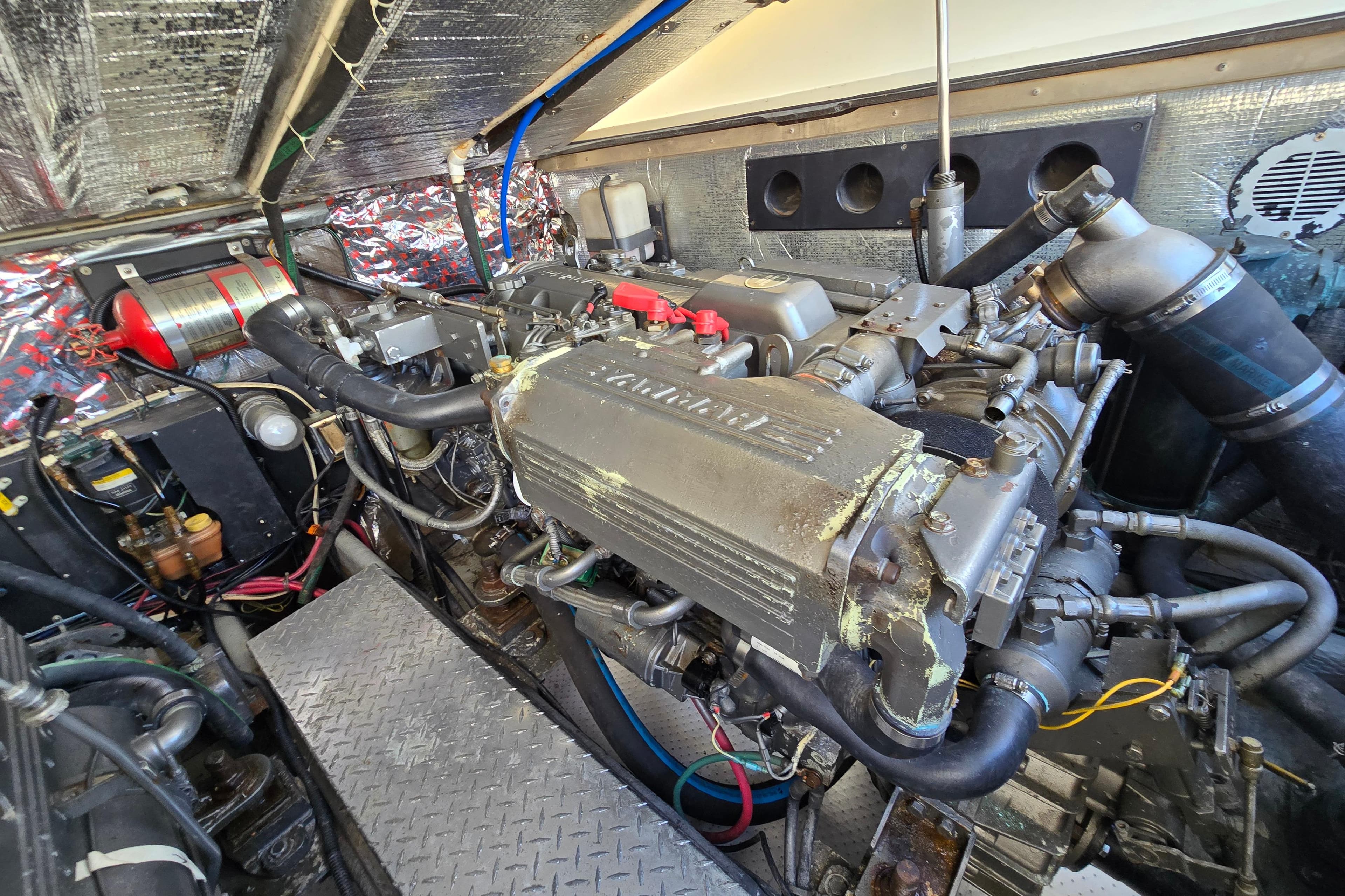 Engine room of 2003 Albemarle 305 Express Fisherman boat, showcasing detailed machinery and components.