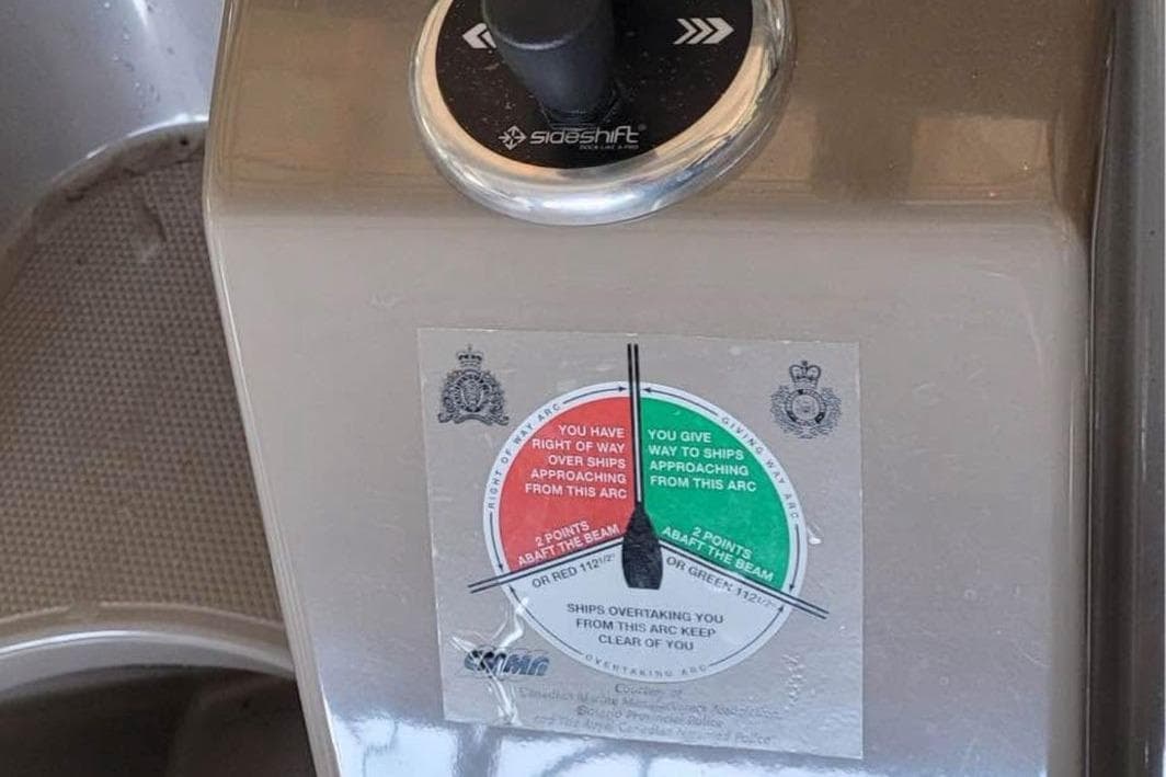 Control panel of a 2008 Cruisers Yachts 330 Express with navigation instructions.