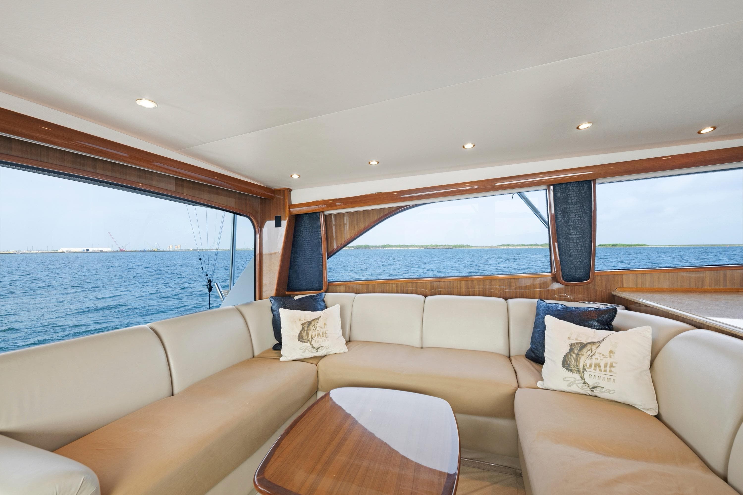 Luxurious interior of a 2005 Viking Convertible yacht with ocean view.