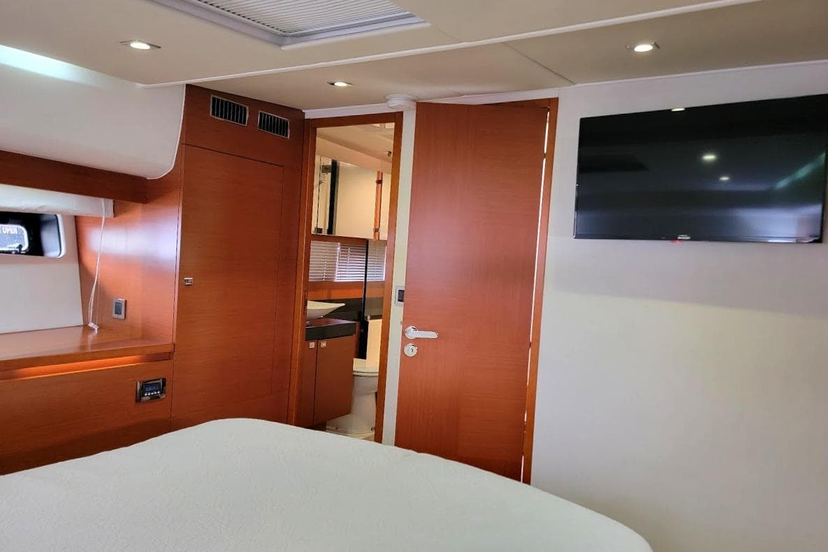 Luxurious interior of 2014 Prestige 550 yacht with wood finish and modern amenities.