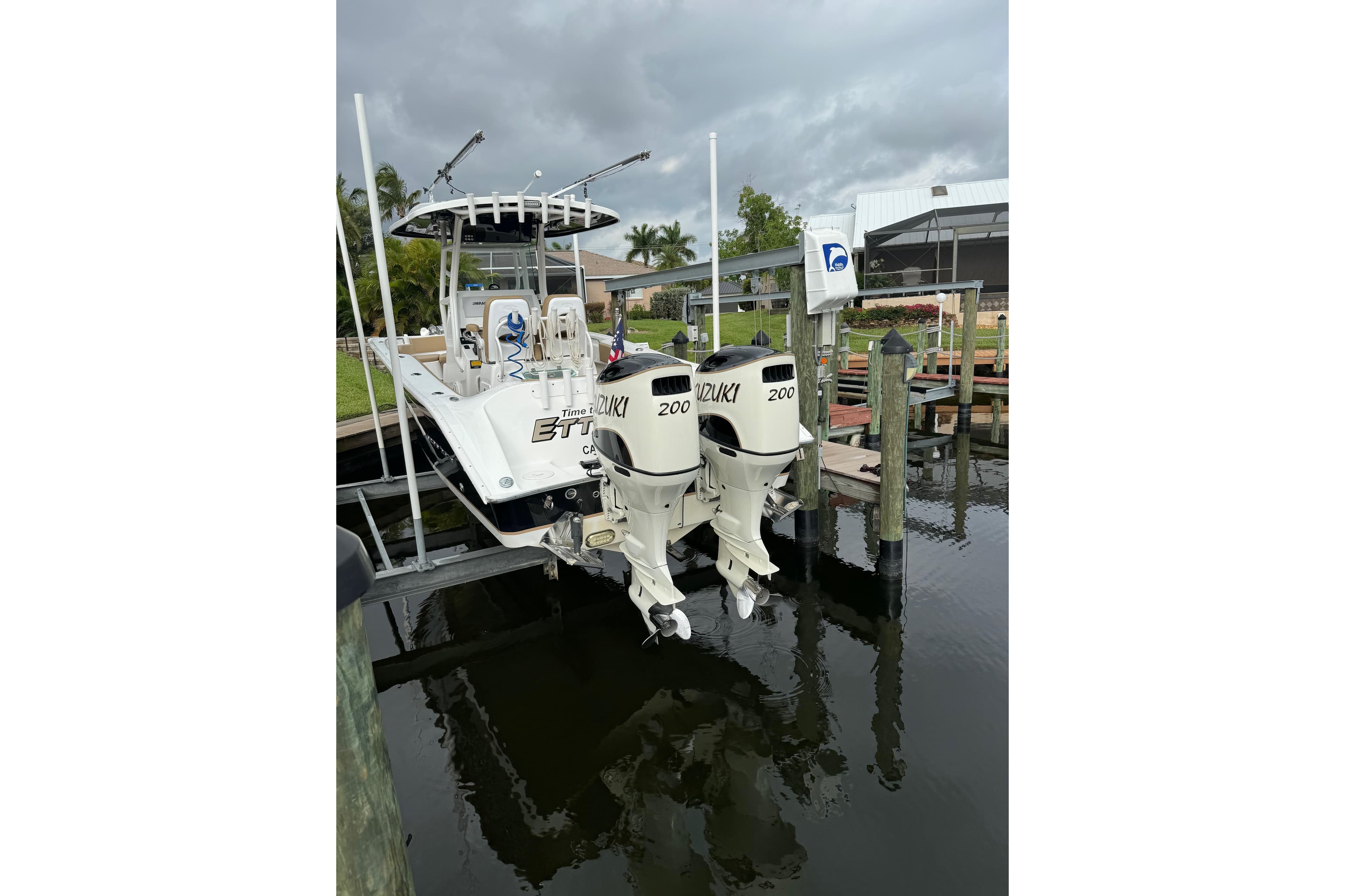 2019 Cape Horn 27 XS boat with twin Suzuki 200 engines docked by the water.