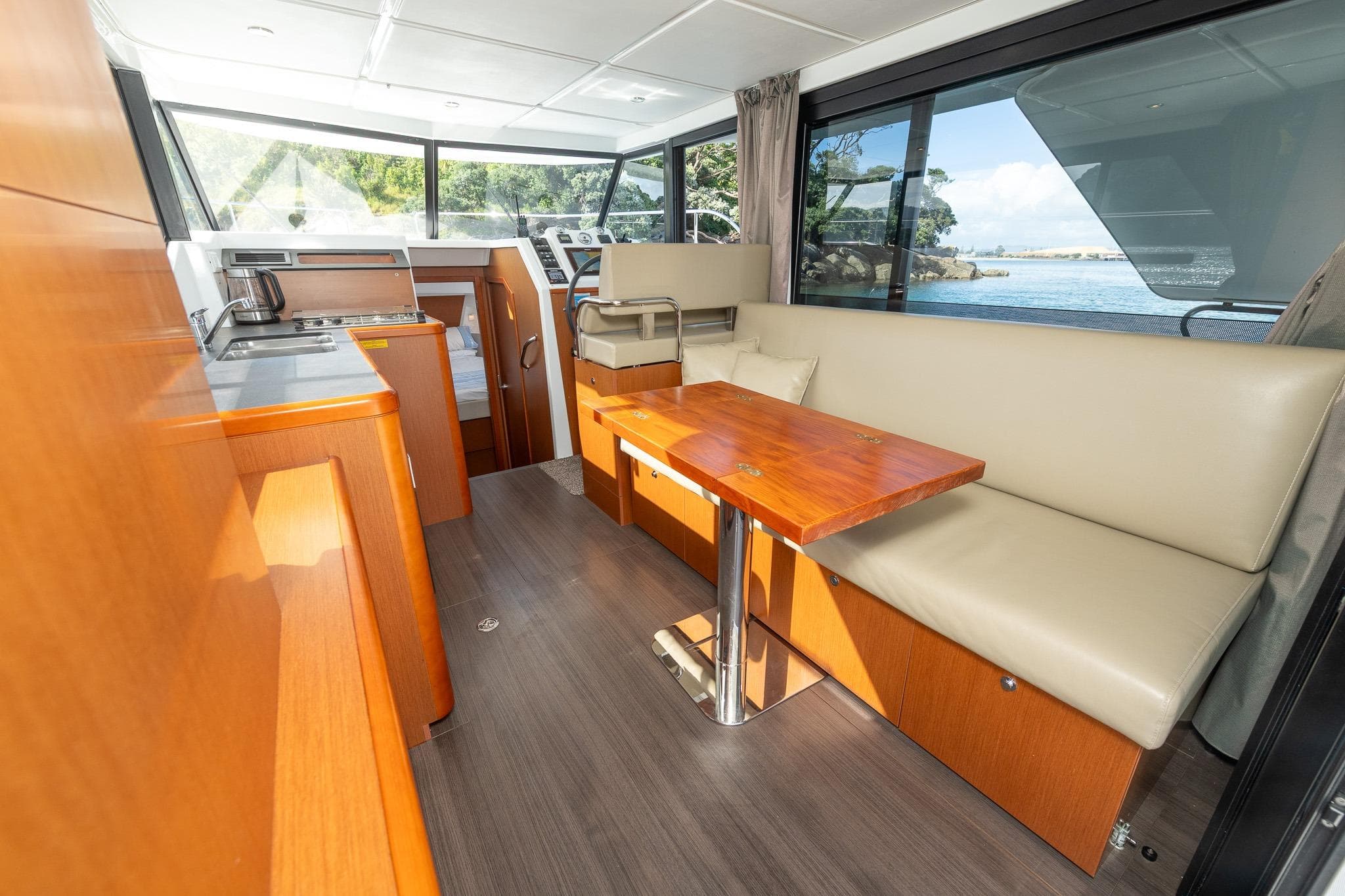 Interior of 2018 Beneteau Swift Trawler 30 with modern seating and dining area.
