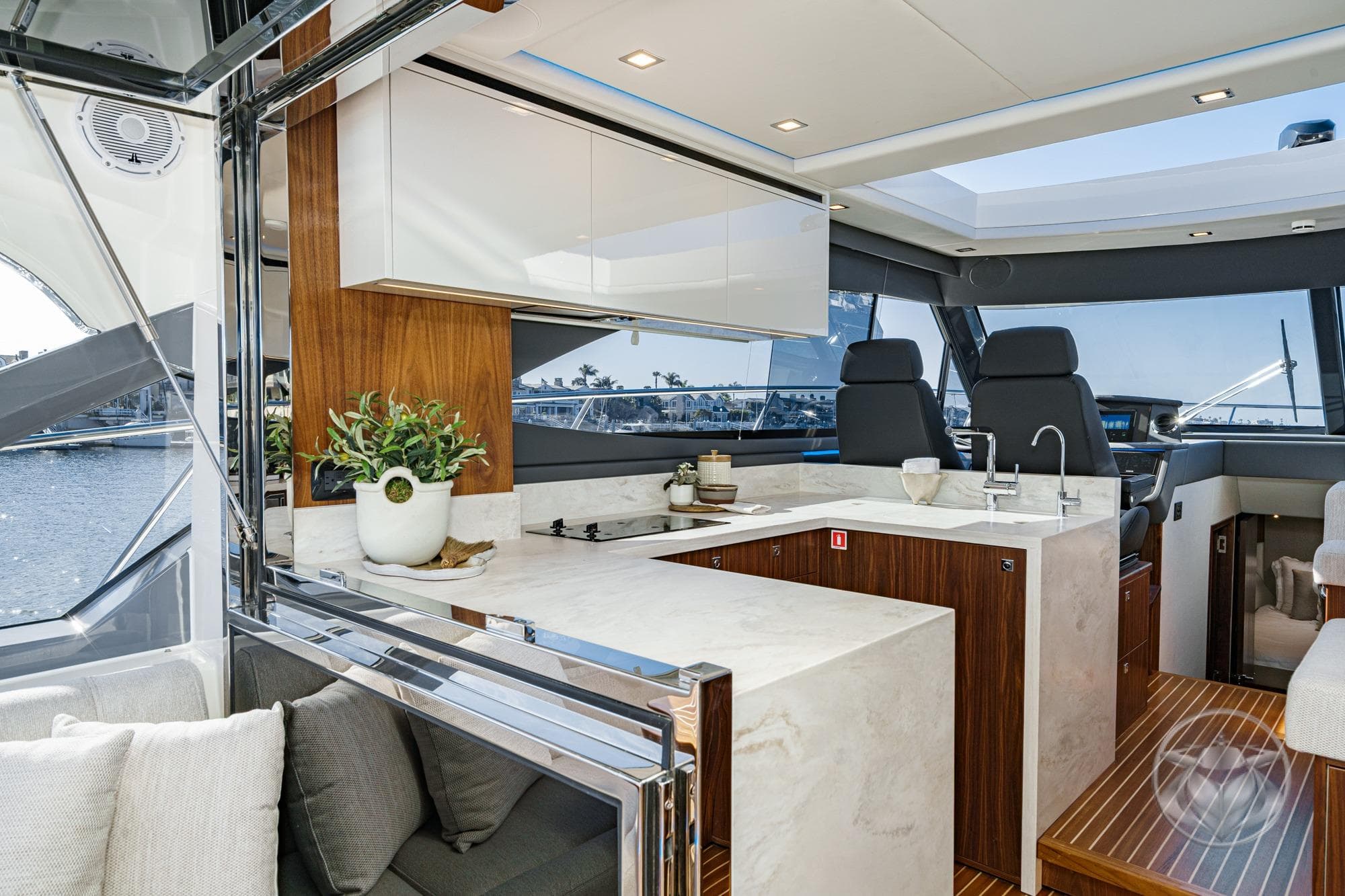 Luxurious interior of 2026 Riviera 4600 Sport Yacht Platinum Edition with modern kitchen design.