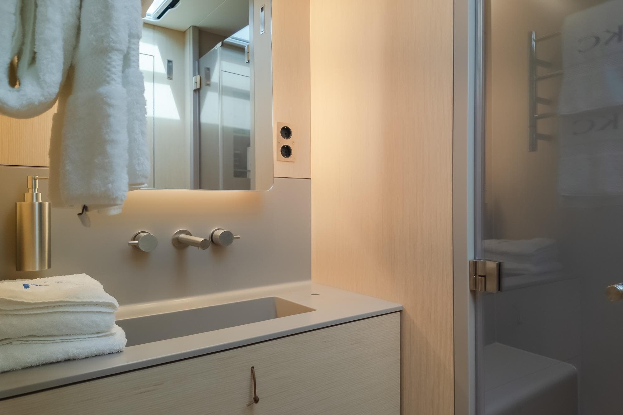 Luxurious bathroom interior of 2024 YYachts Y8, featuring modern fixtures and elegant design.