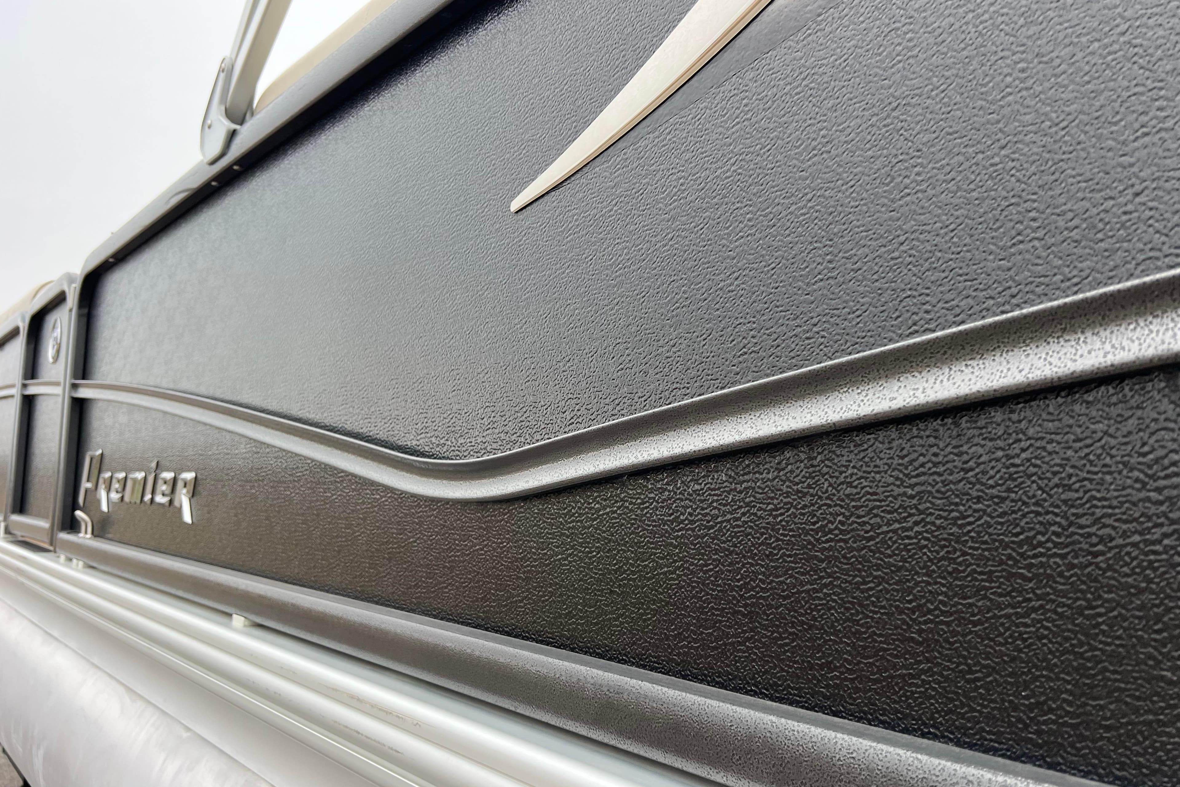 Close-up of 2017 Premier 230 SunSation RF boat exterior with textured black finish.