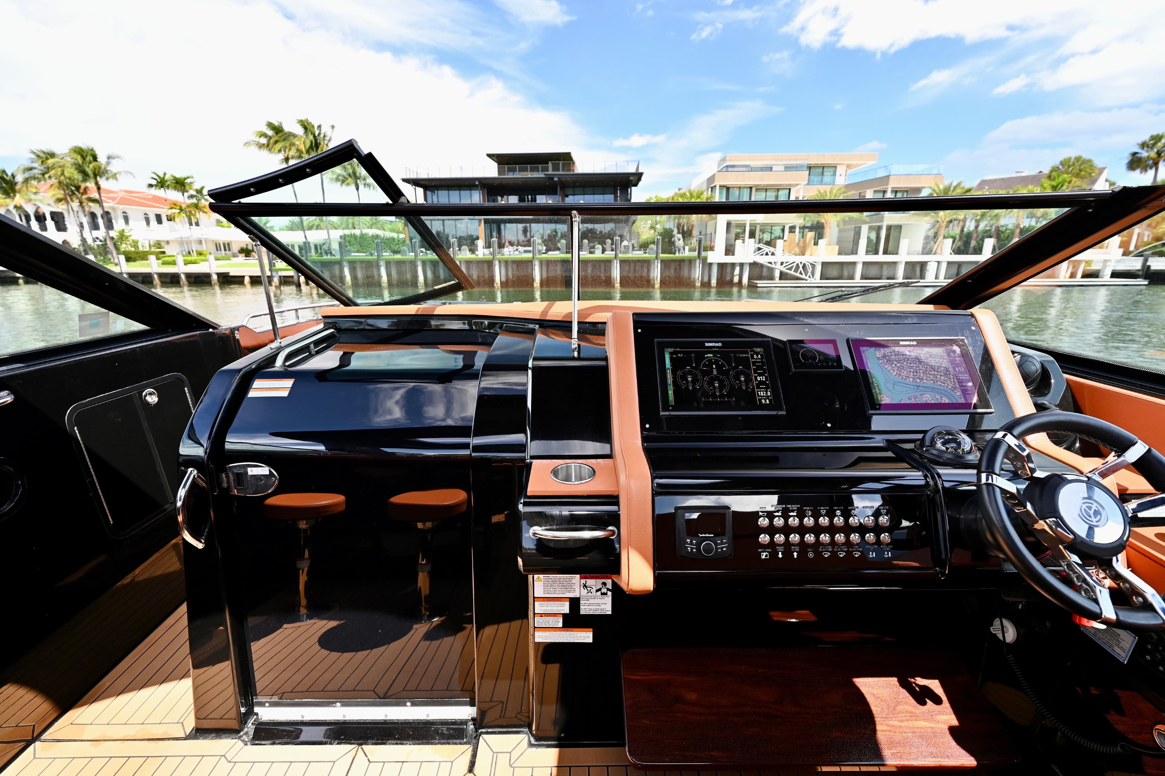 2022 Cruisers Yachts 38 GLS OB helm with modern controls and waterfront view.
