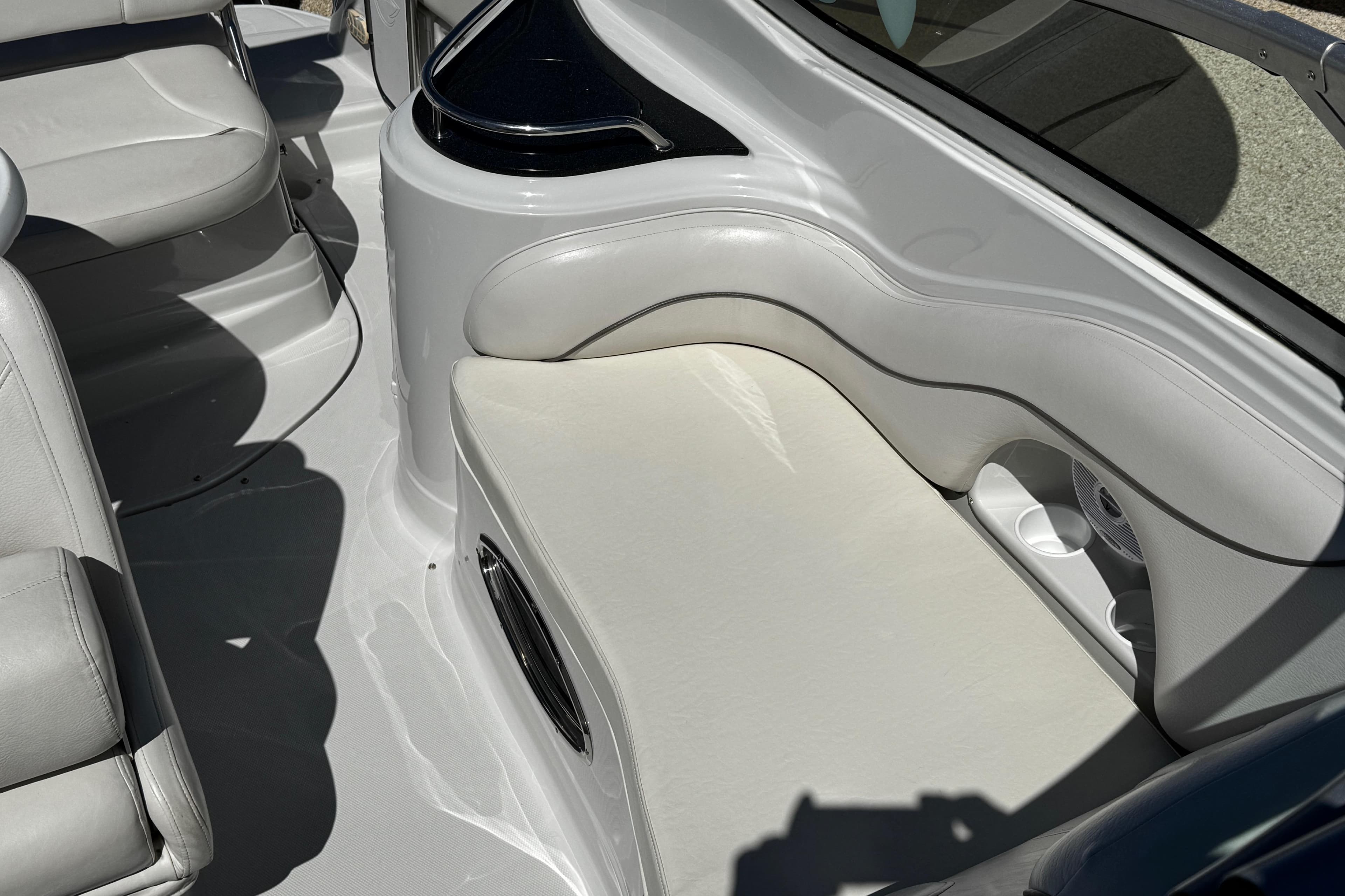 2004 Crownline 250 CR boat interior with white seating and cup holders.