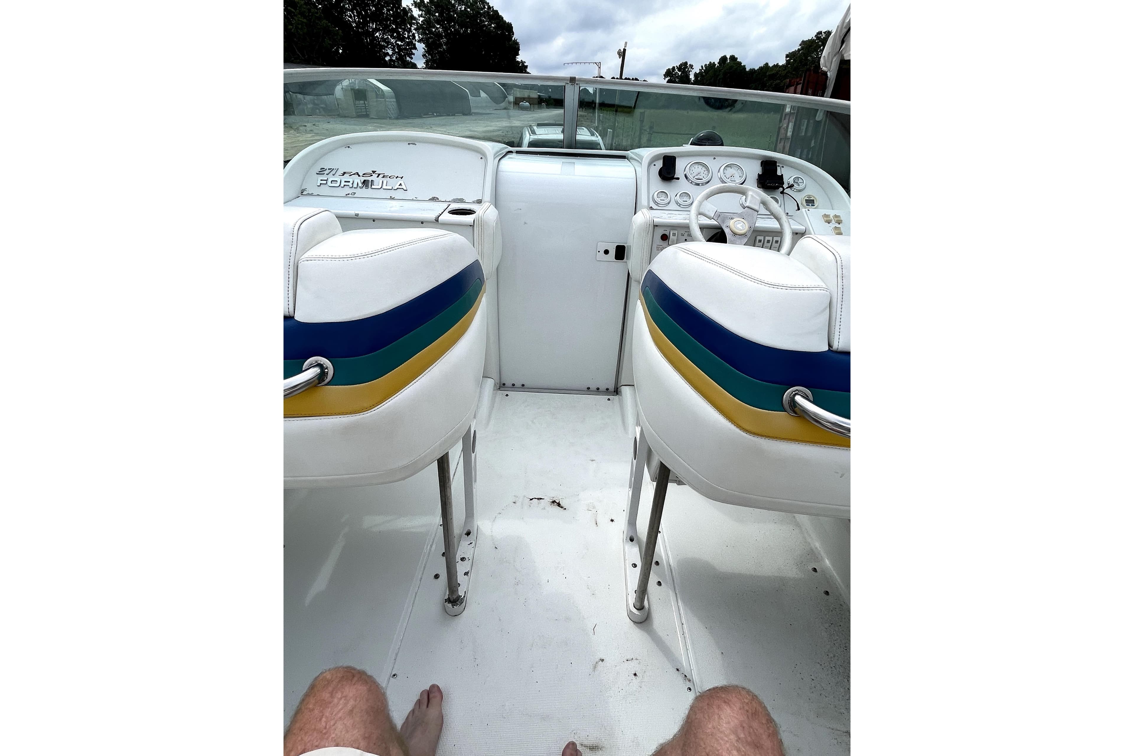 1999 Formula 271 FASTech boat interior with colorful seats and dashboard view.