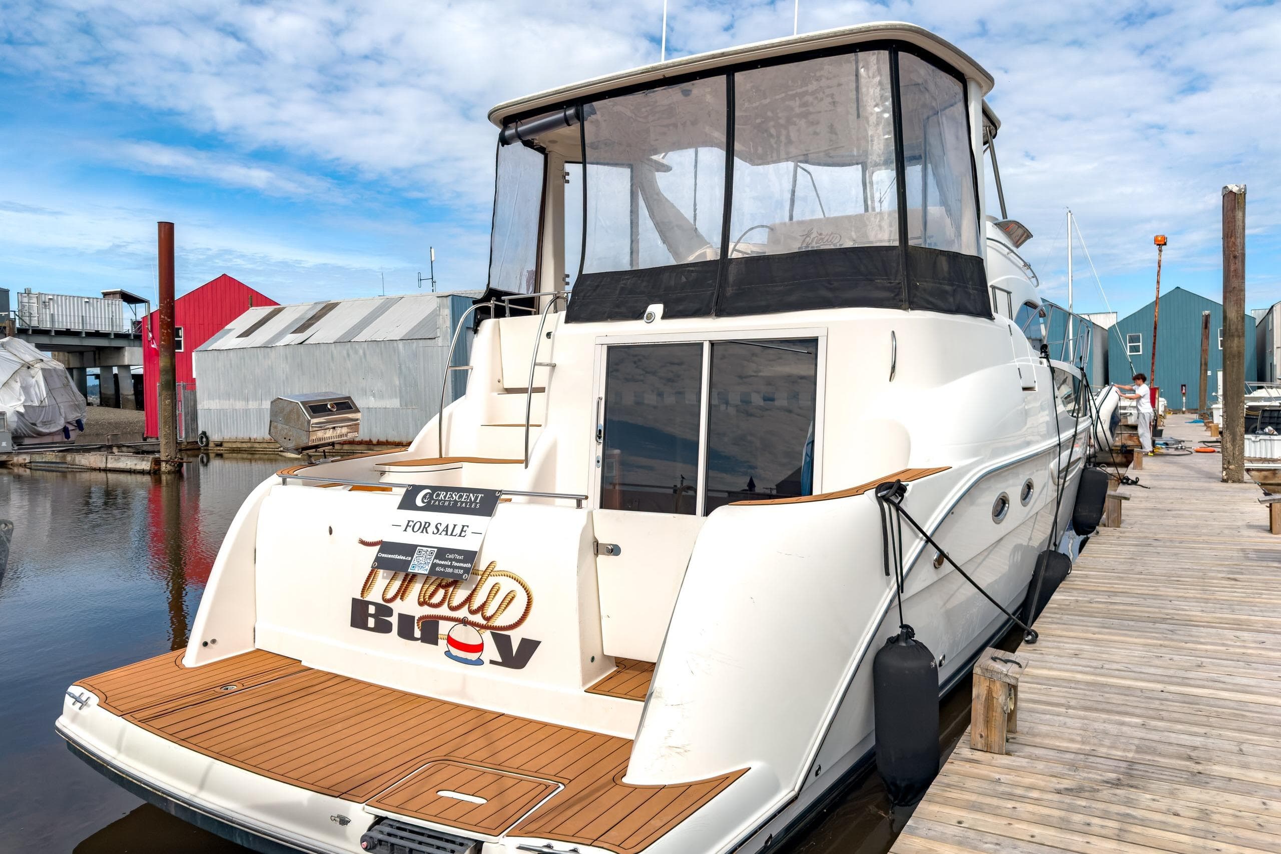 2005 Meridian 459 Motoryacht docked, for sale, featuring spacious deck and modern design.