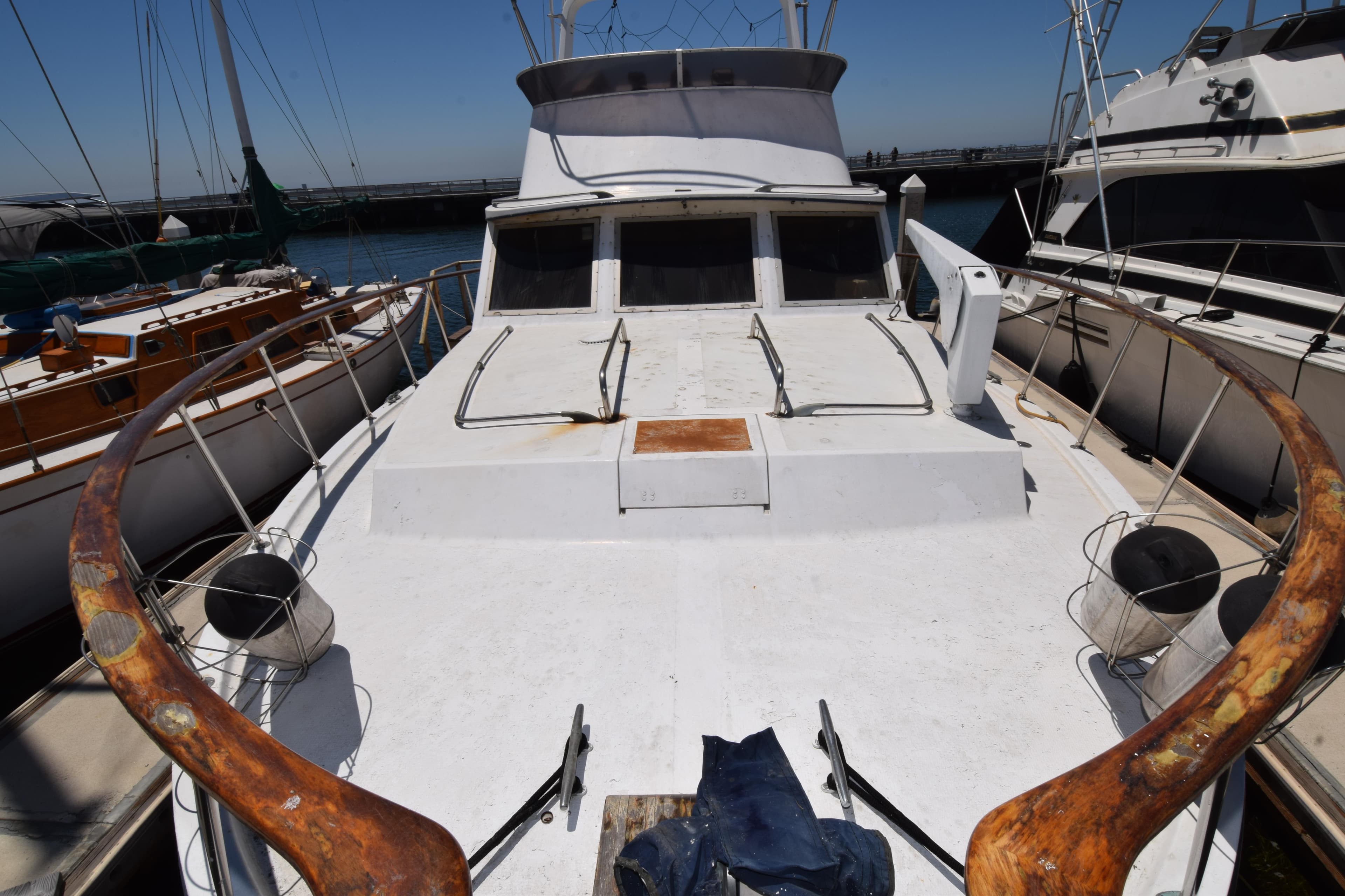 1977 Uniflite 42 Double Cabin yacht docked, showcasing spacious deck and classic design.