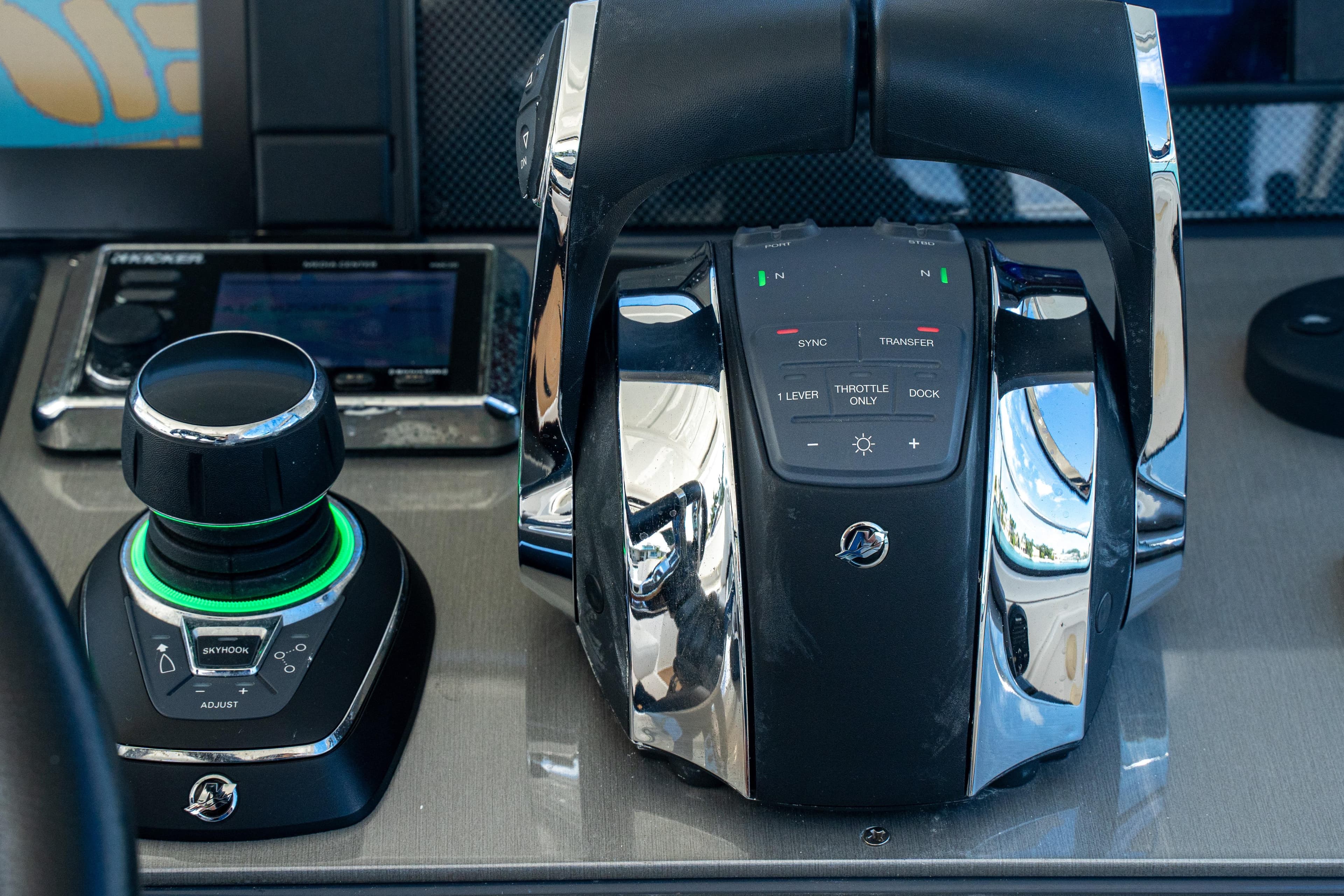 Control panel of 2018 Cruisers Yachts 390 Express Coupe with joystick and throttle controls.
