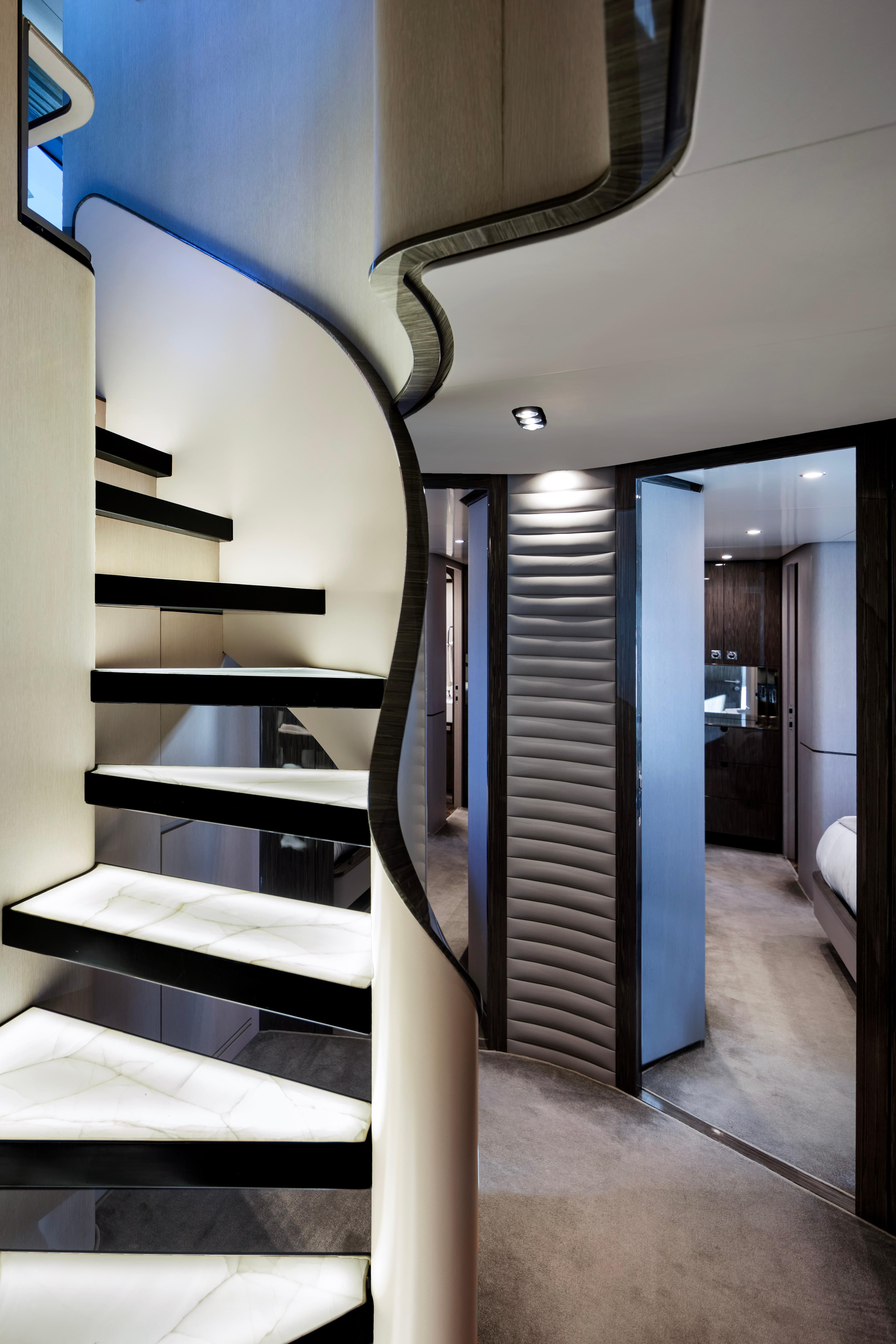 Luxurious interior of 2017 Azimut Grande 30 Metri yacht with elegant spiral staircase.