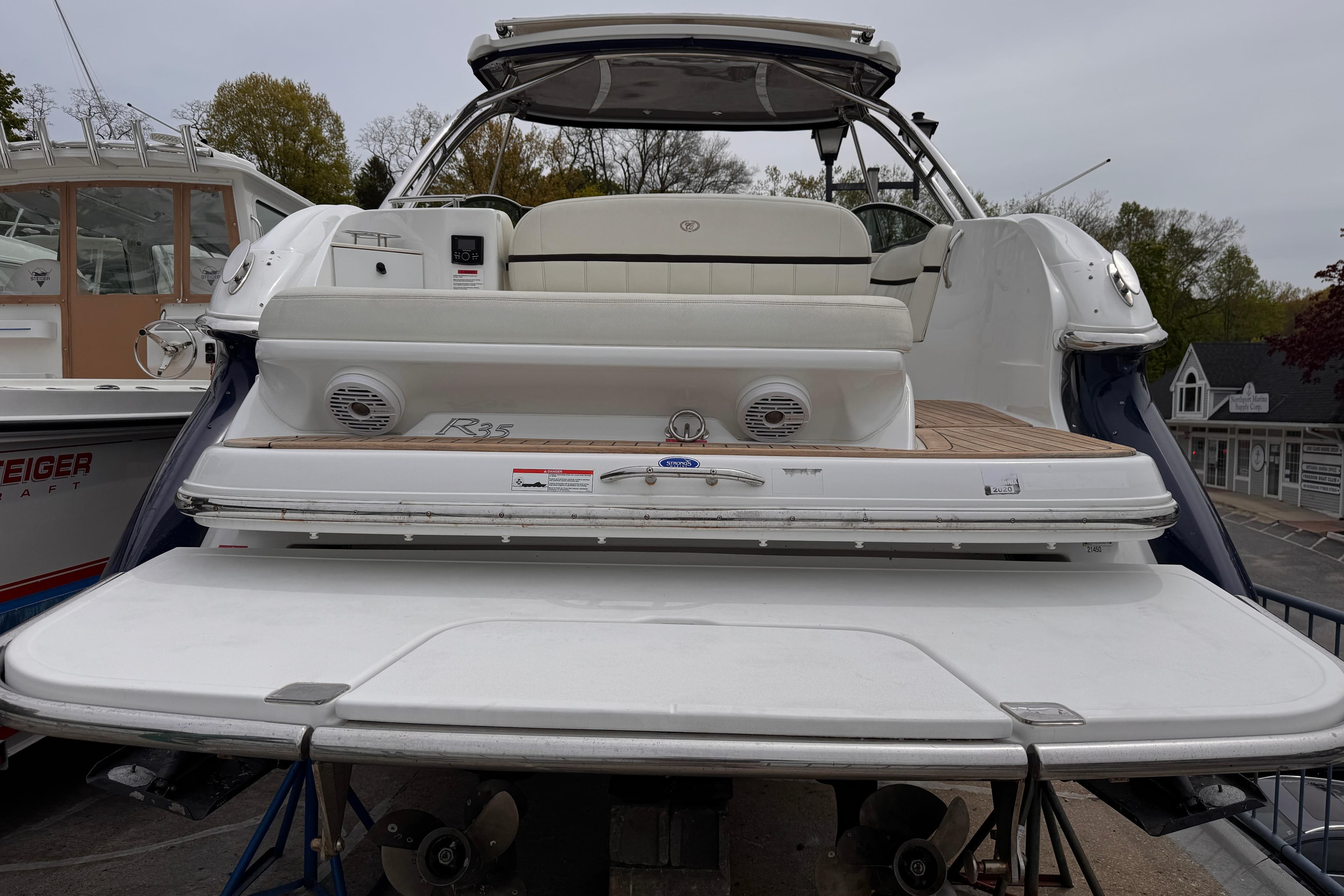 2018 Cobalt R35 boat with spacious deck and seating, docked at marina.