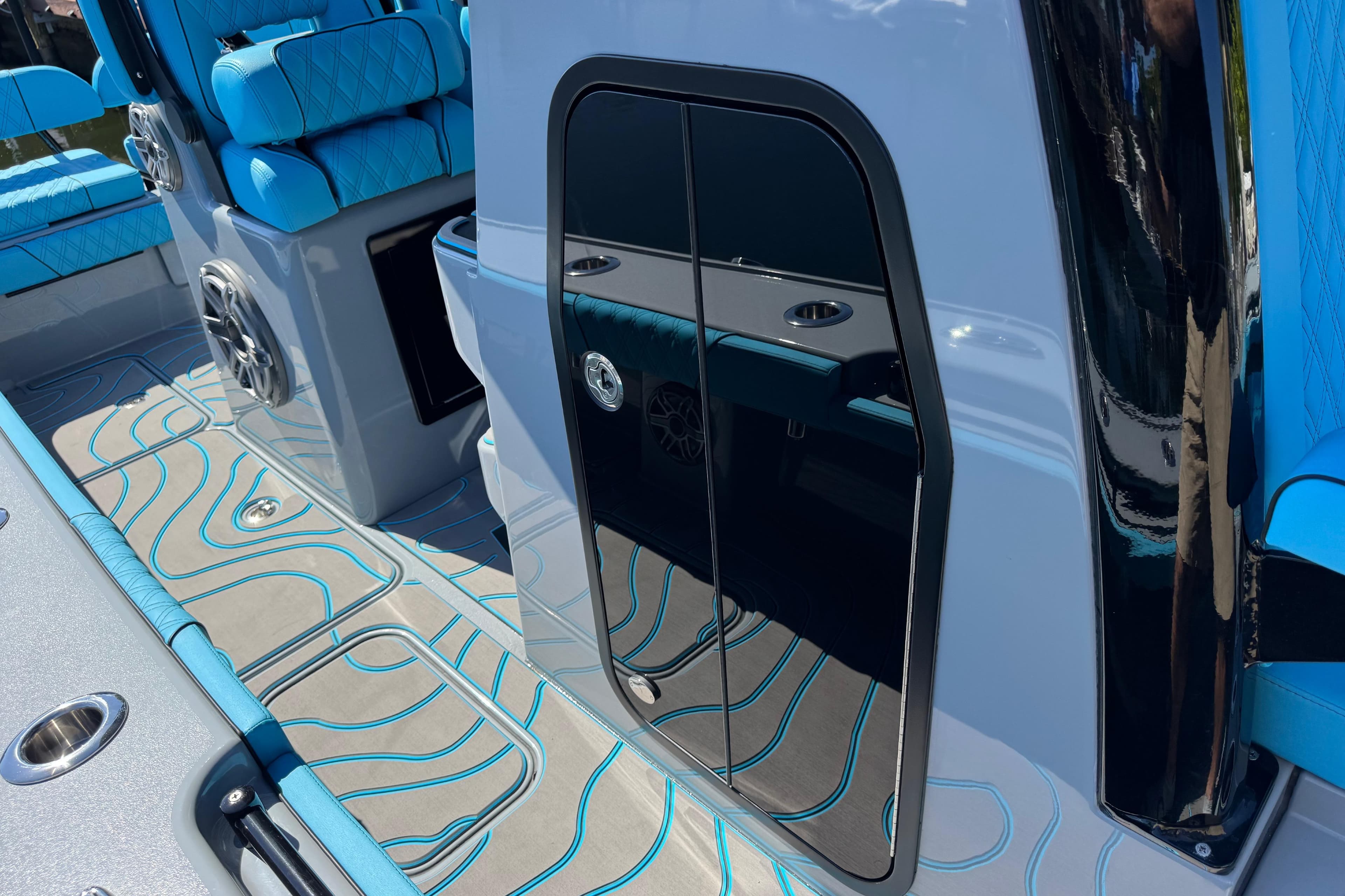 2026 Costa Custom Boats 264 HC interior with blue seating and sleek design.