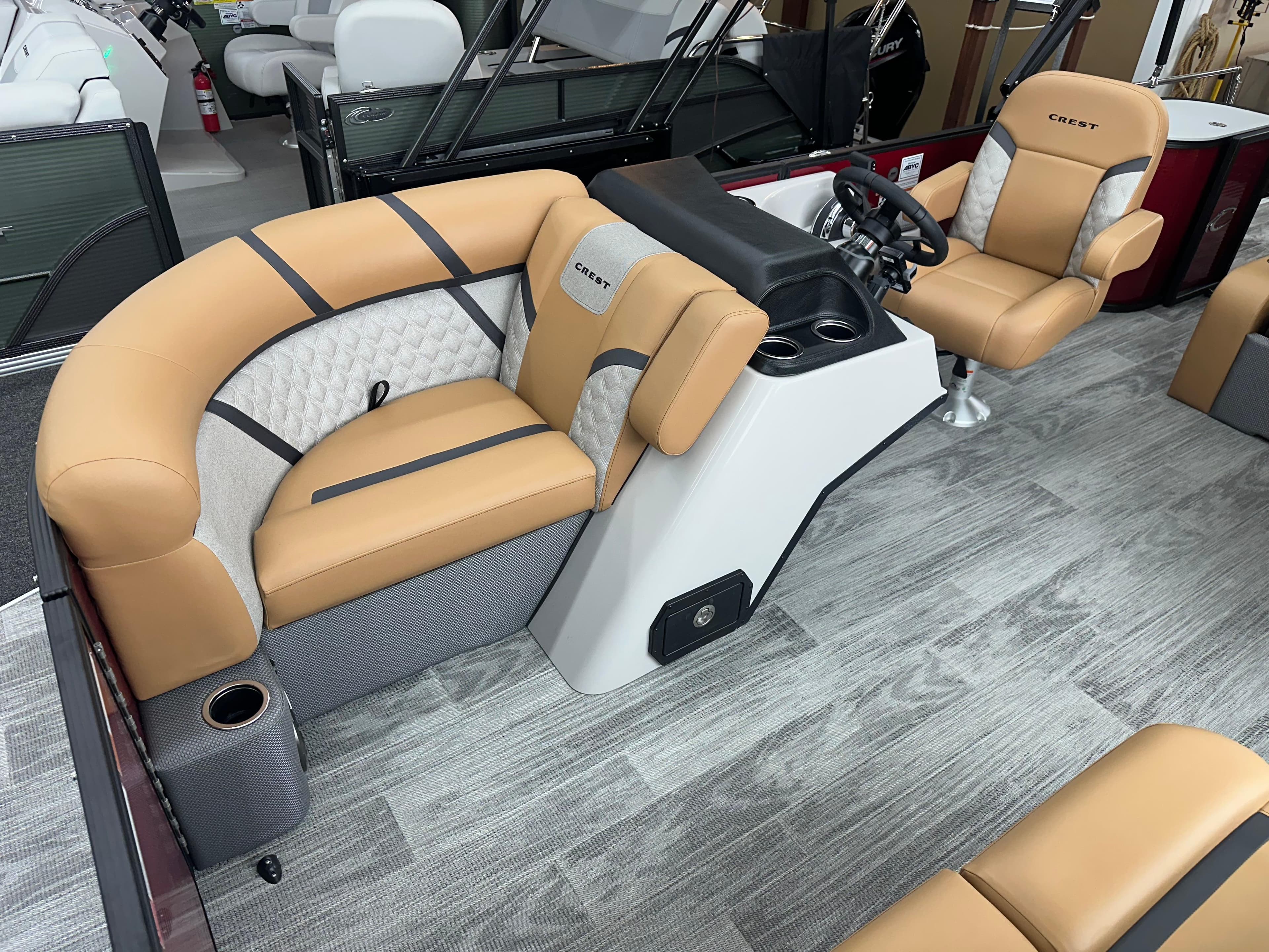 Luxurious interior of 2025 Crest Classic 200 boat with tan seating and modern helm.