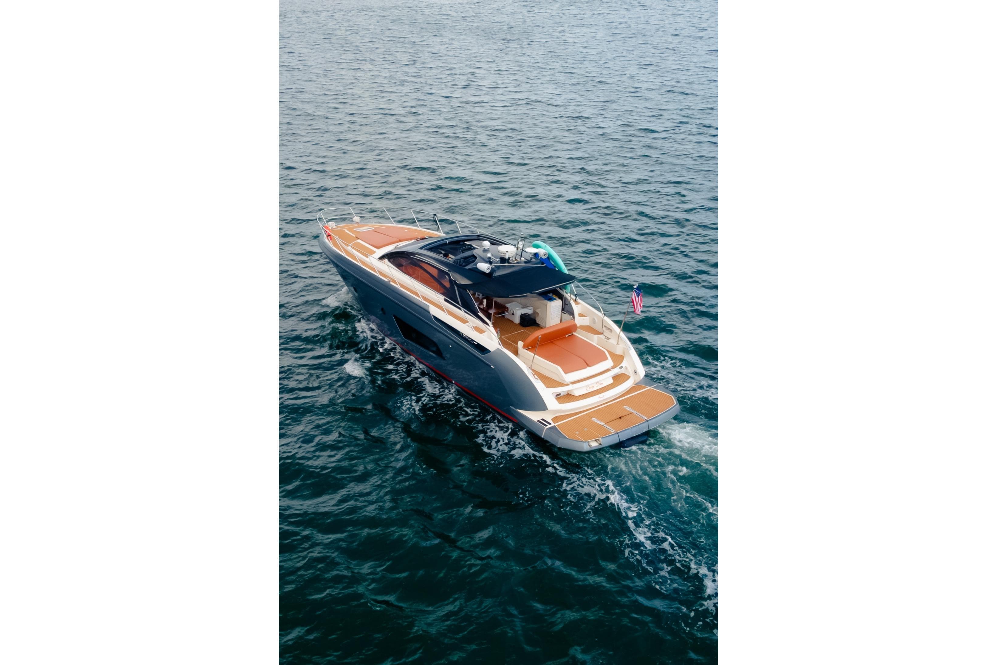 2013 Azimut Atlantis 48 yacht cruising on open water, showcasing sleek design and luxury features.