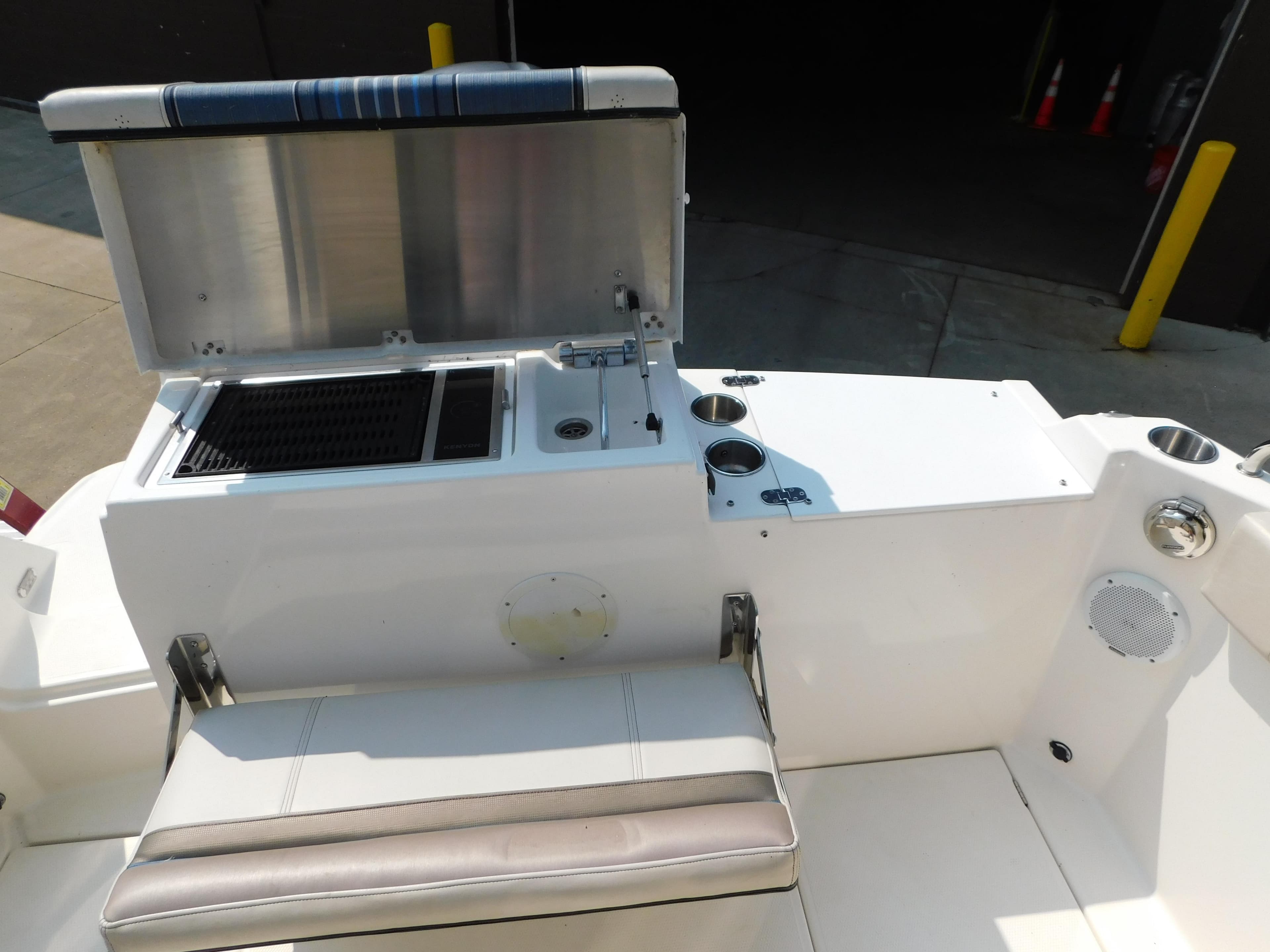 2017 Cutwater C-24 boat interior with seating, grill, and storage compartments.