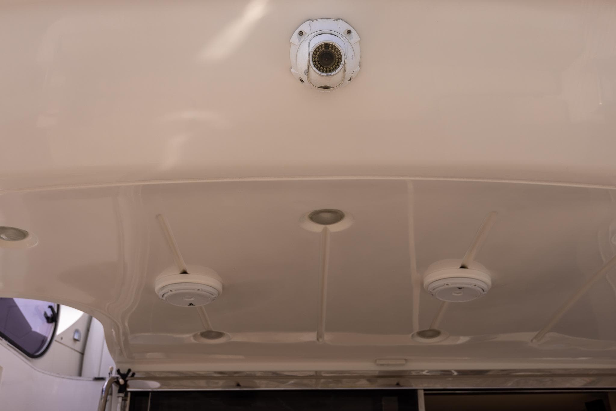 Ceiling view of 2014 Azimut 54 Flybridge yacht with lighting fixtures.