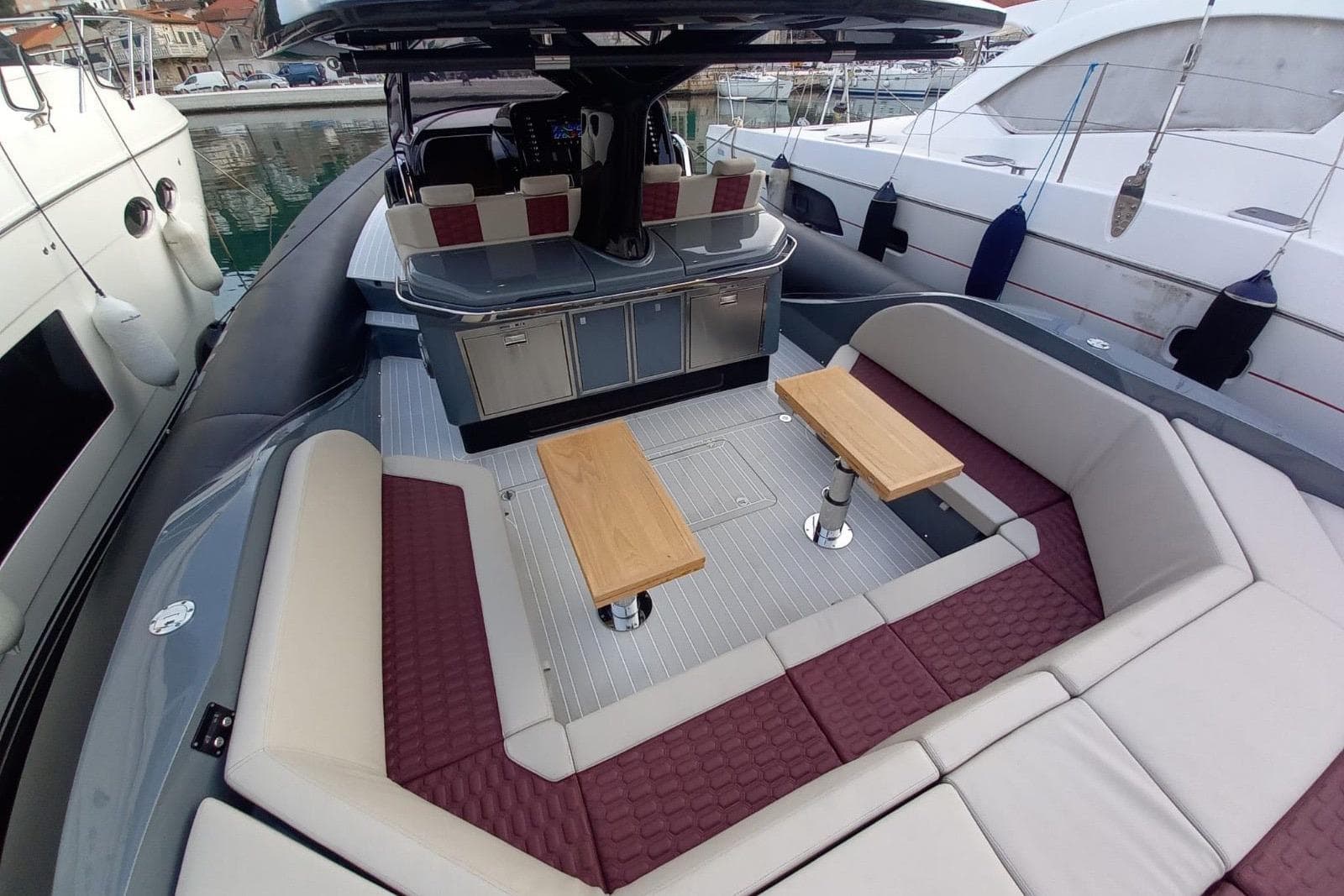 Luxury 2022 SACS Strider 15 yacht interior with elegant seating and tables.