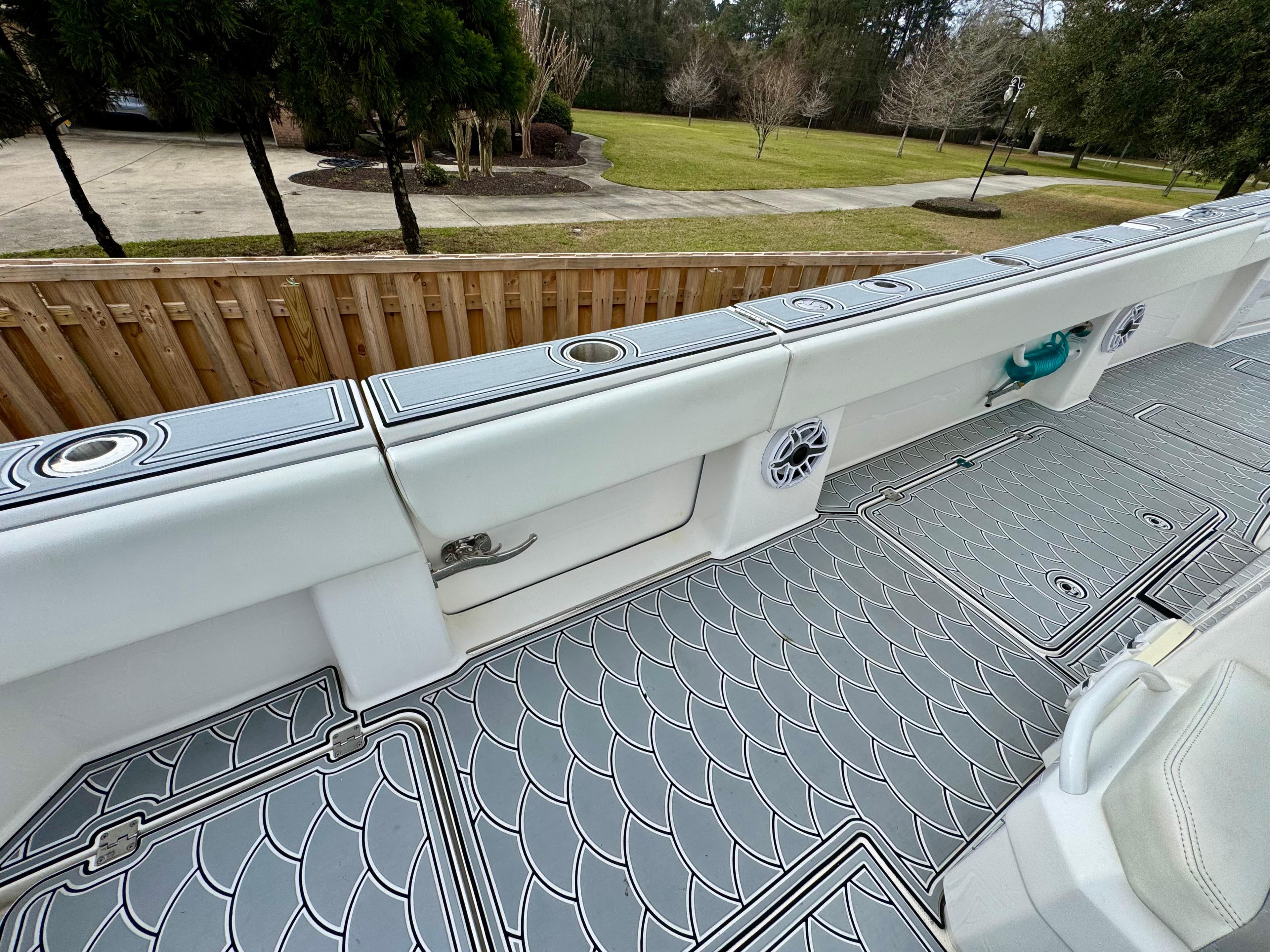 2022 Invincible 35 Catamaran deck with stylish non-slip flooring and storage compartments.
