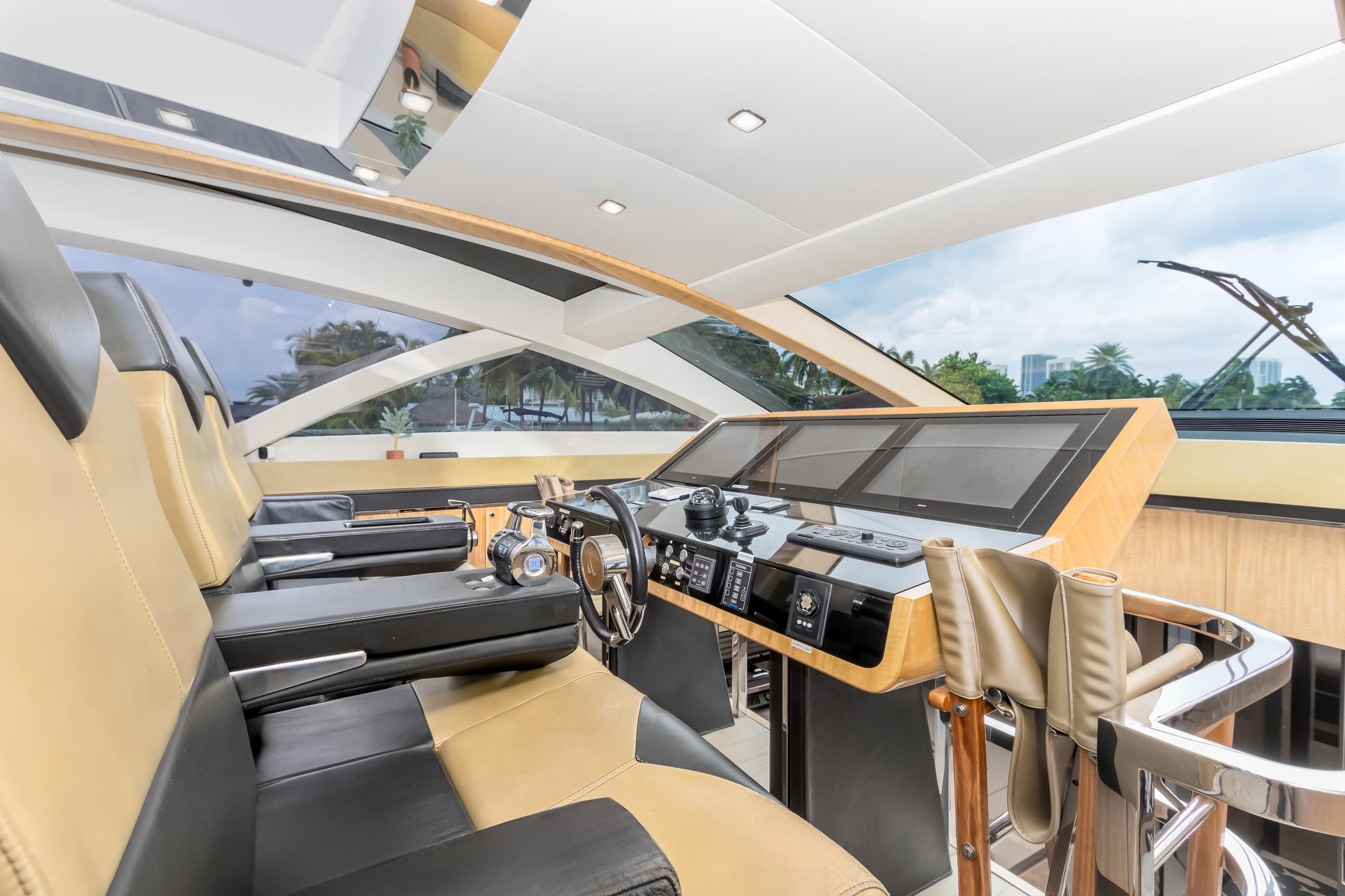 Luxurious interior of 2012 Cheoy Lee 76 Alpha yacht with modern helm and seating.